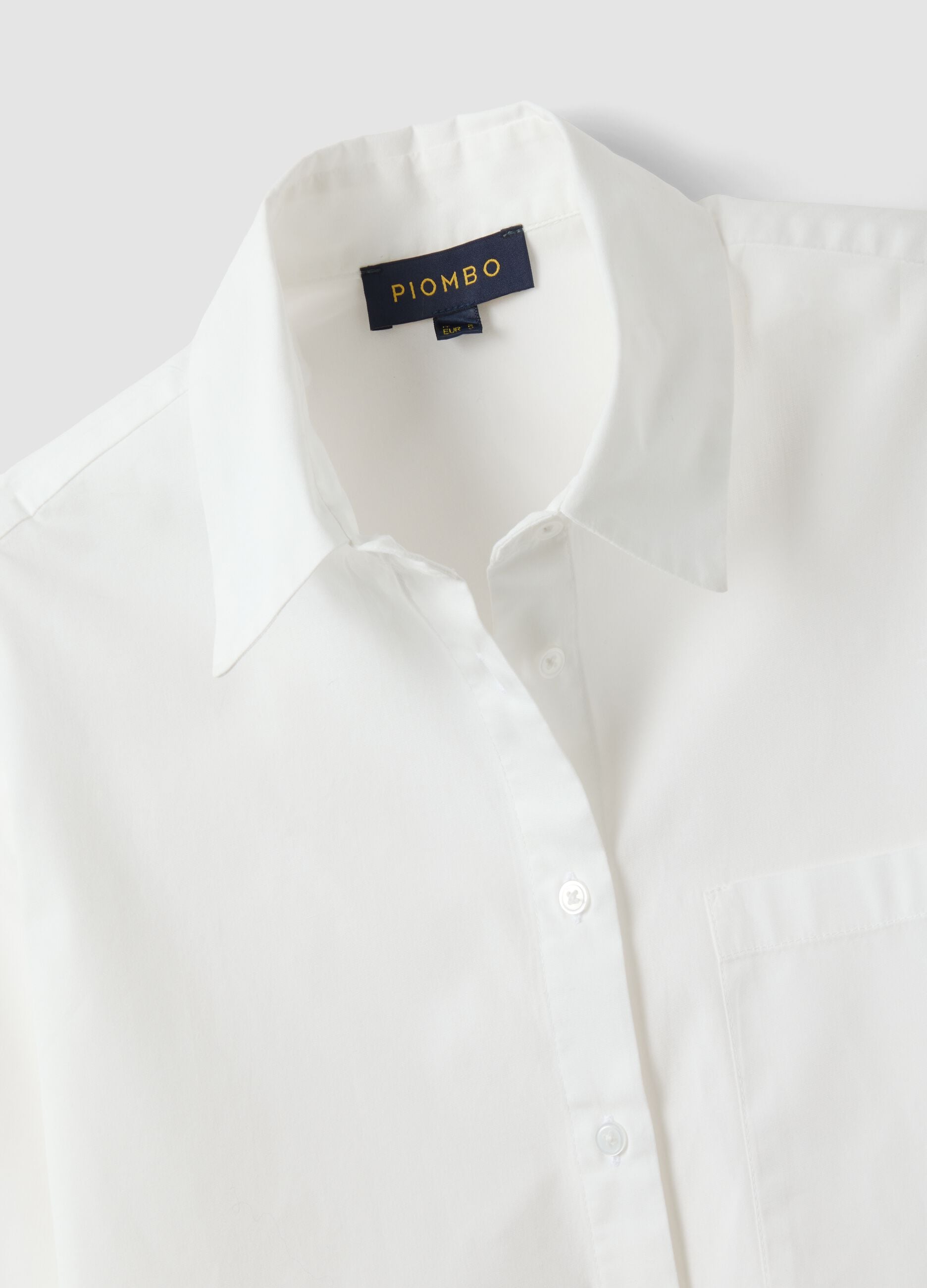 White pure-cotton shirt with patch pocket and oversized fit