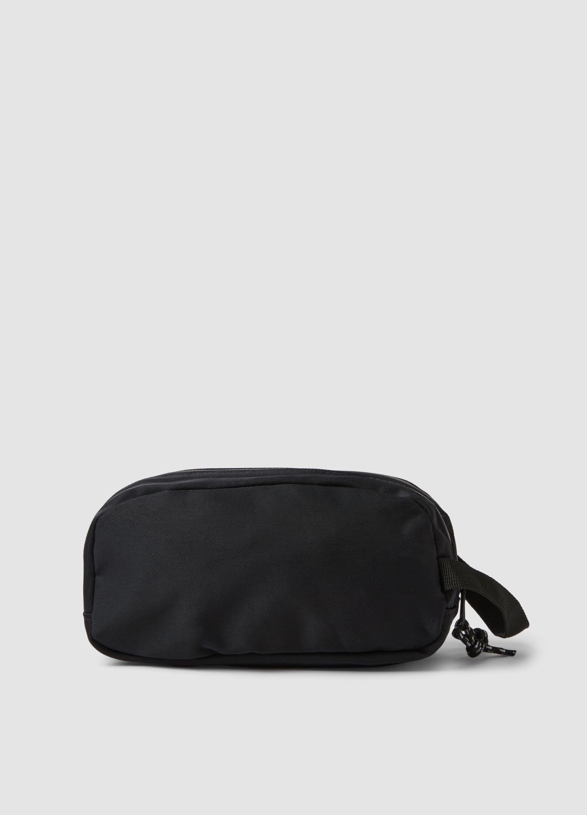 Black toiletry bag with front pocket and zip