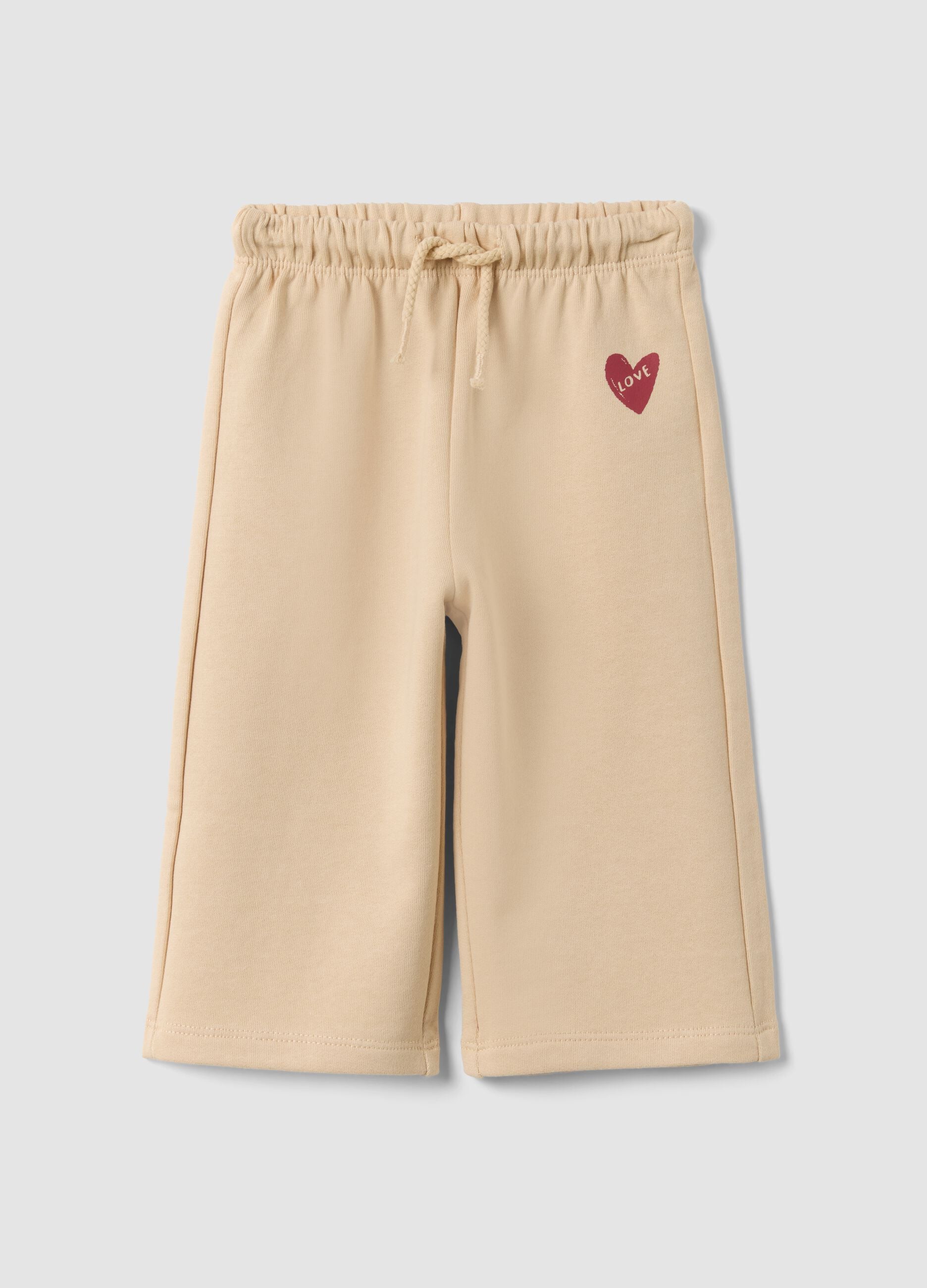 Beige pure cotton trousers with elasticated waist and print for baby girl