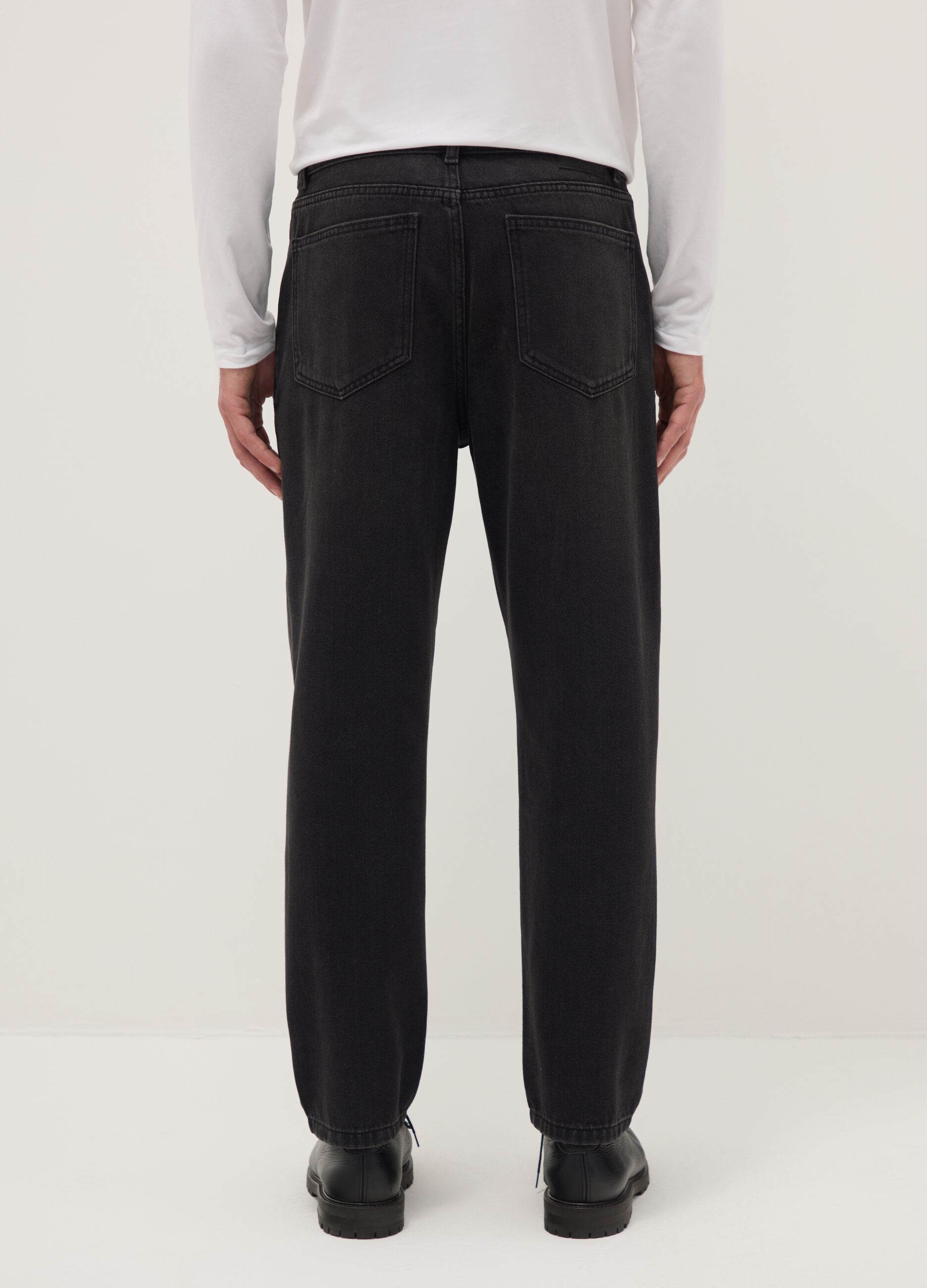 Black cotton blend jeans with regular tapered fit