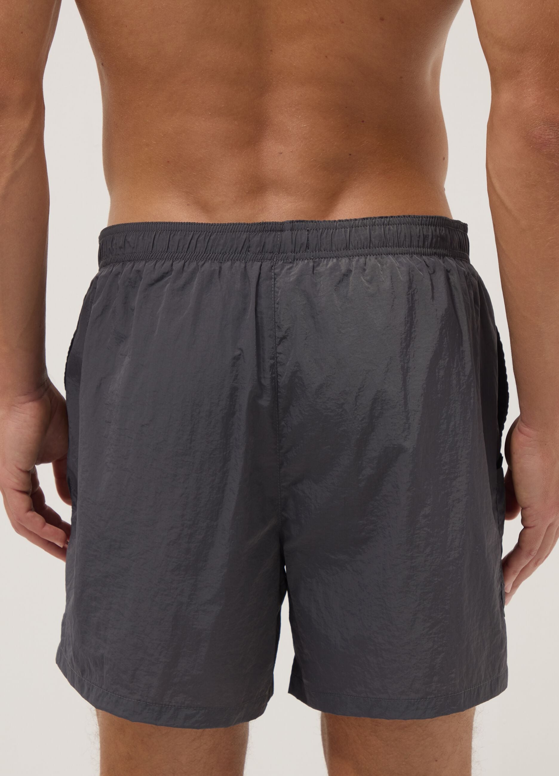 Grey swim shorts with elasticated waistband
