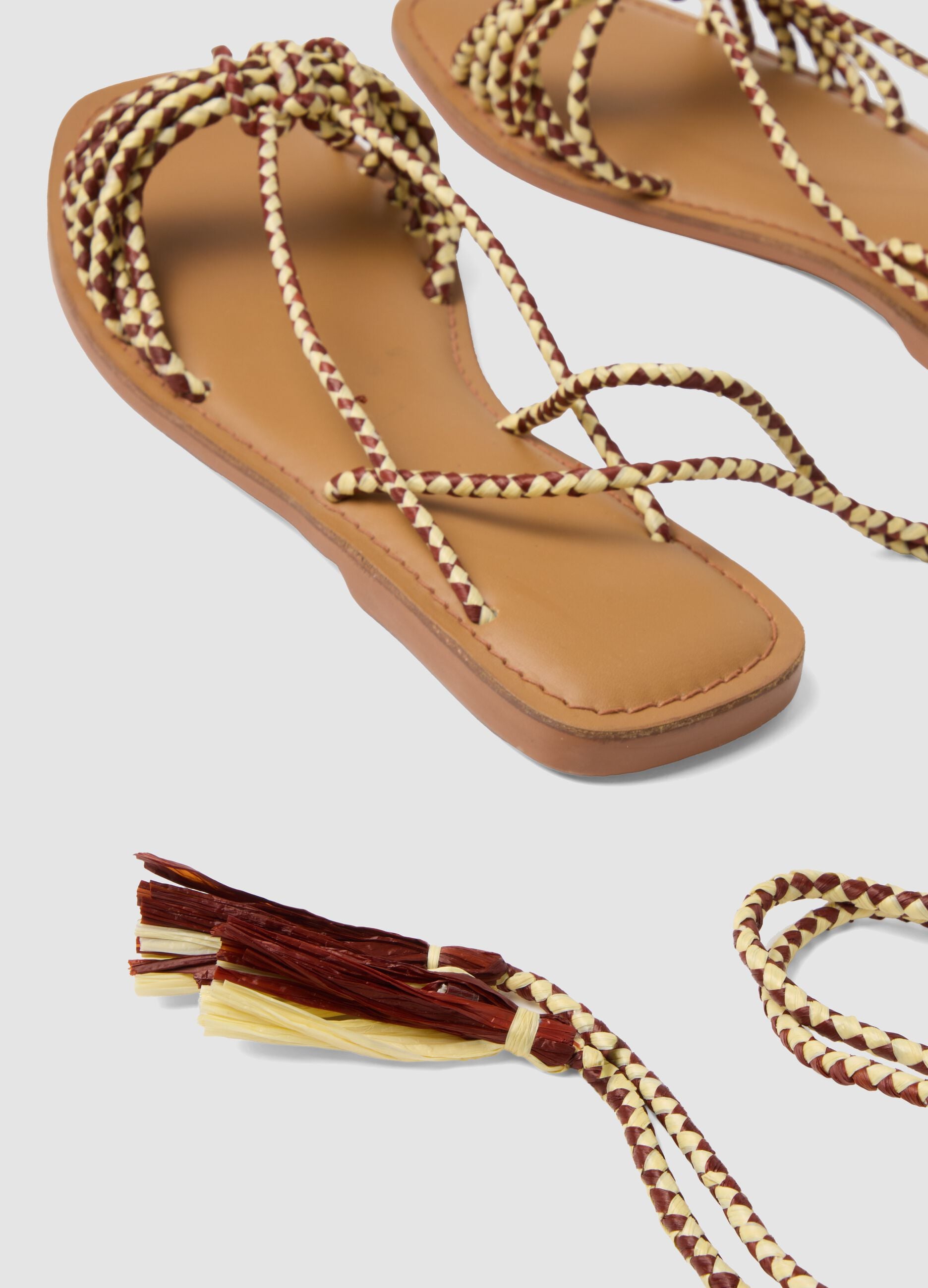 Brown flat sandals with braided tie-up straps