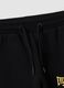 Black 100% cotton kids&rsquo; tracksuit bottoms with yellow side stripes_3