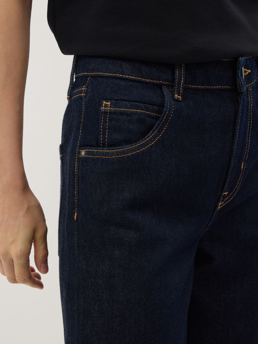 Blue denim bootcut jeans in cotton and lyocell blend_3
