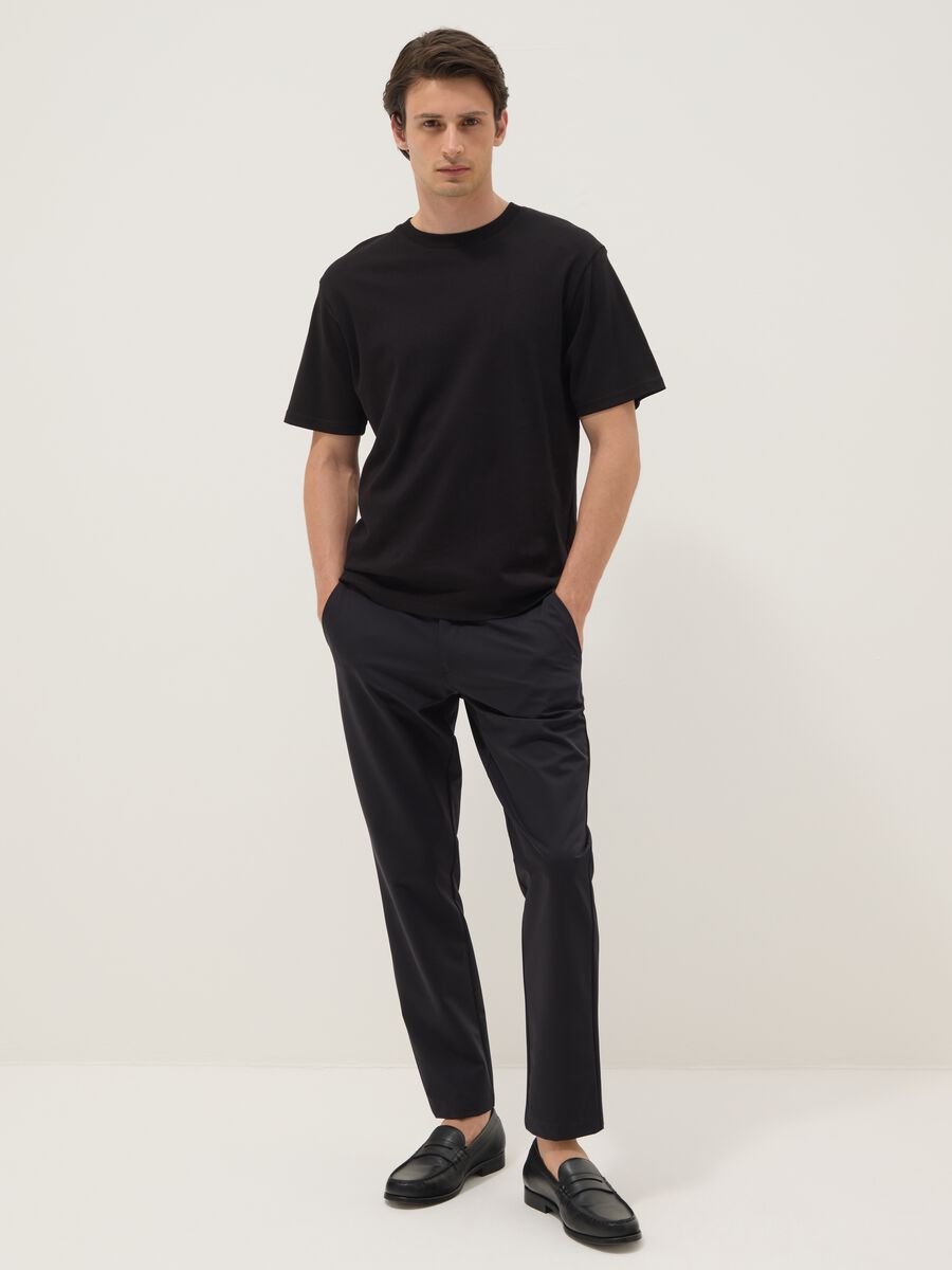 Black stretch carrot-fit chino trousers_0