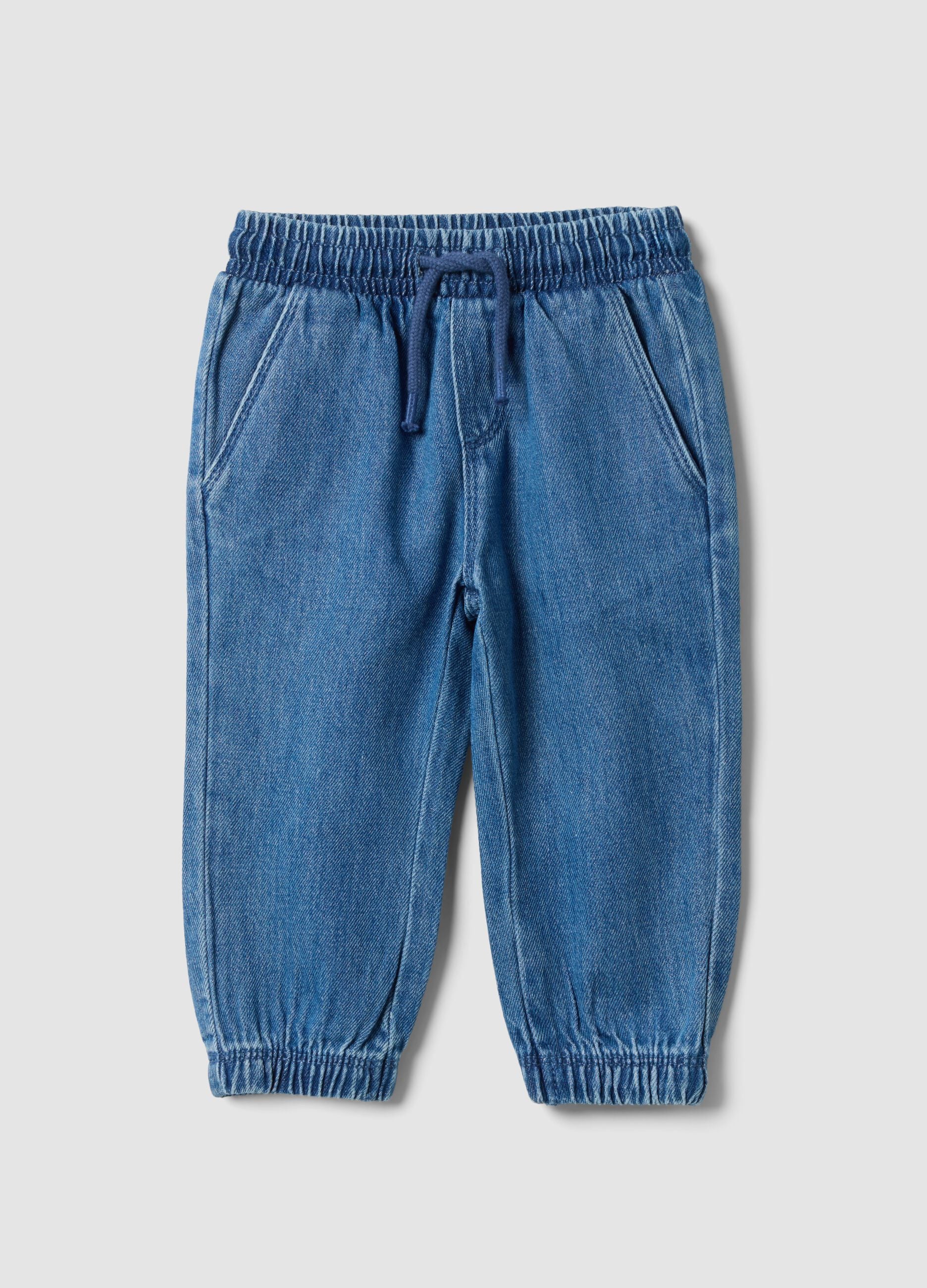 Blue denim trousers in a cotton and viscose blend with an elasticated waistband