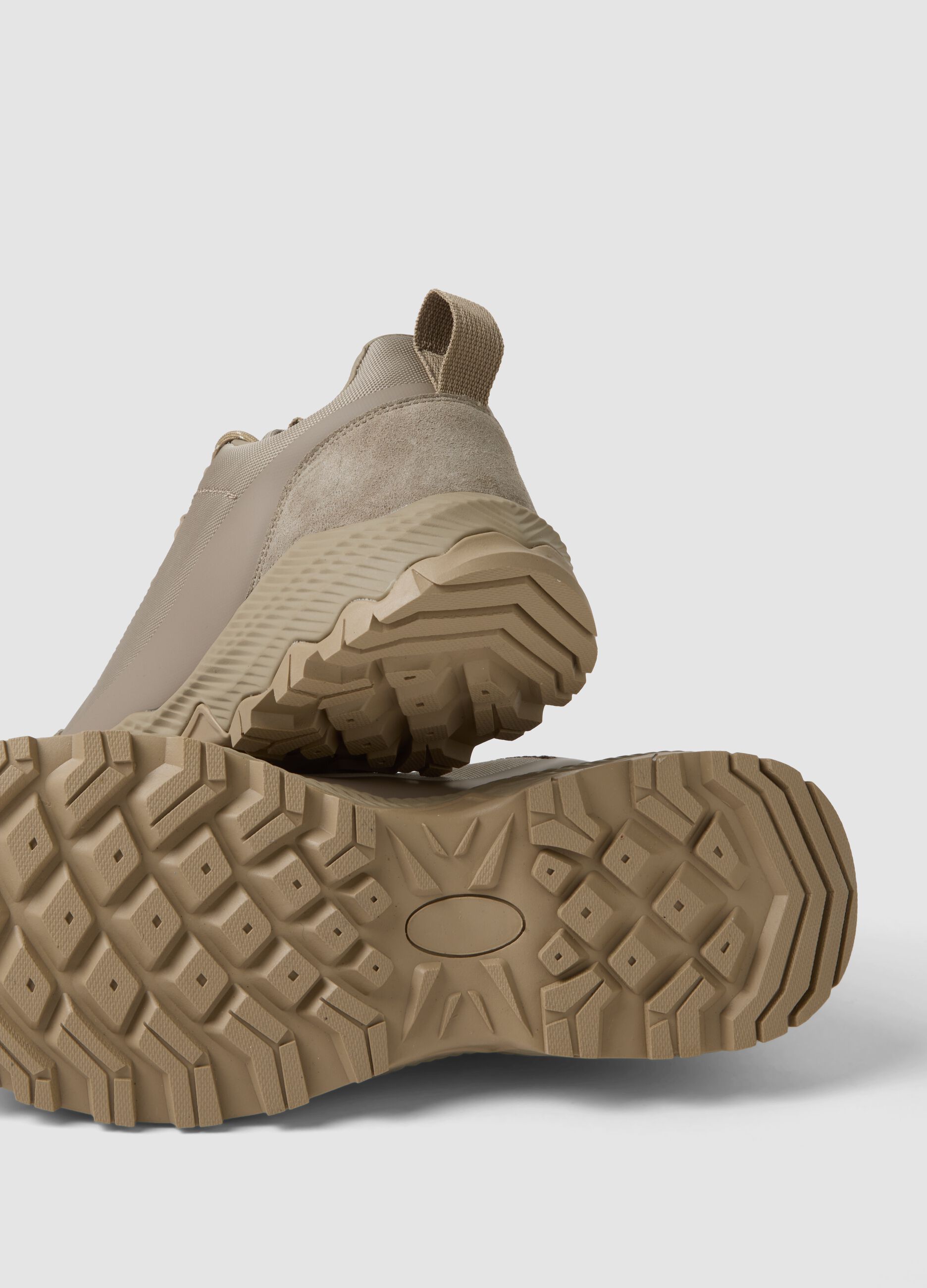Beige low-top sneakers with lug sole