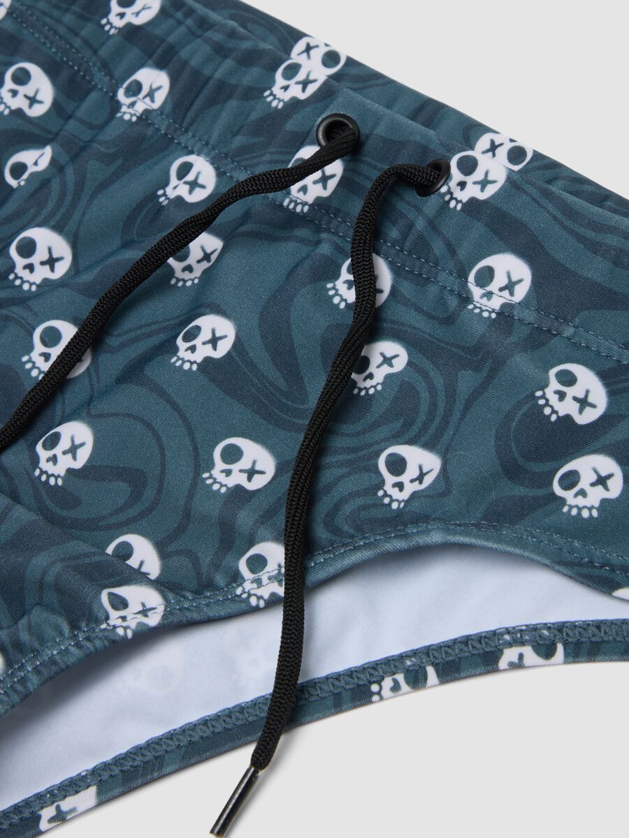Slip mare blu in tessuto elasticizzato con stampa teschi_2
