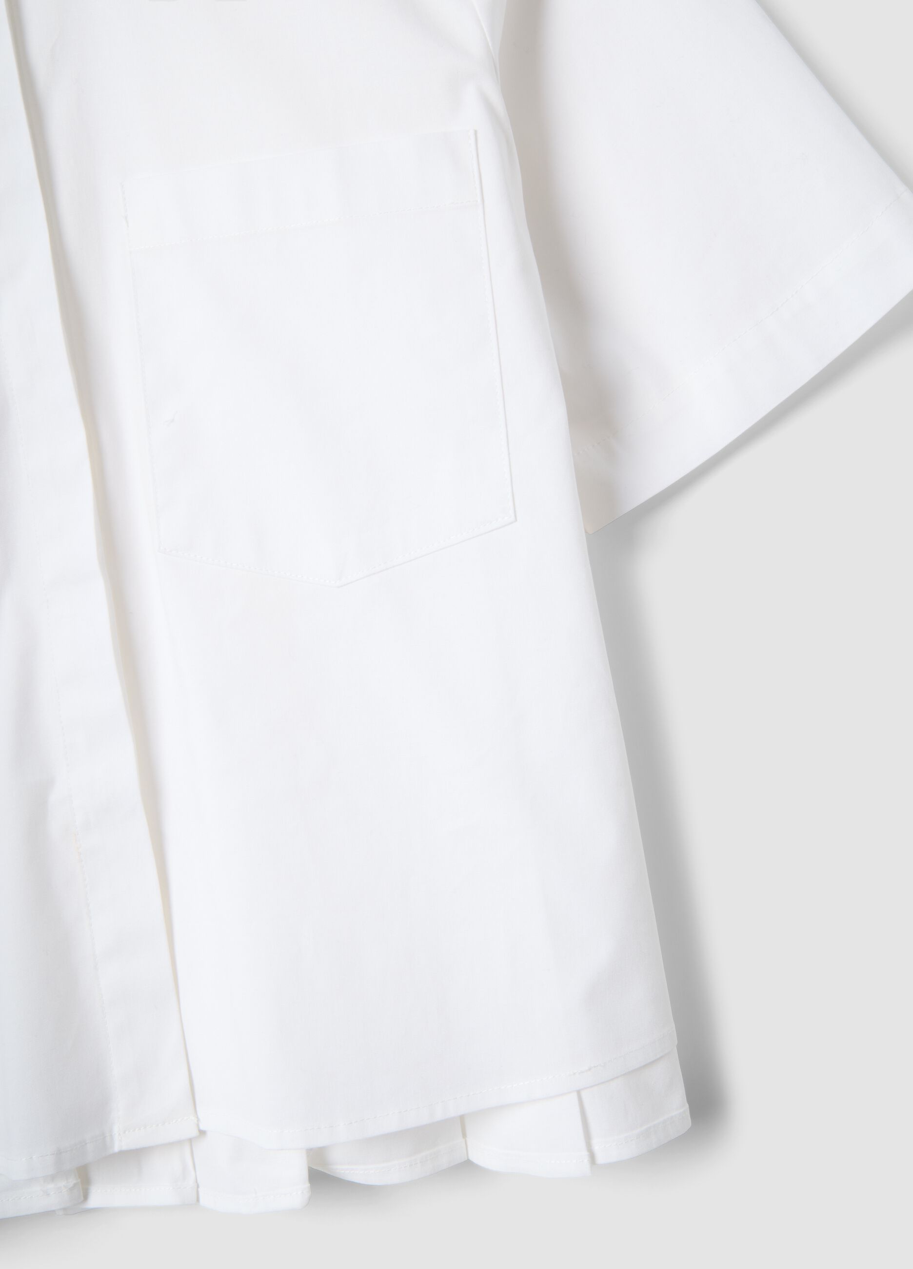 White stretch cotton oversized fit shirt with small pockets