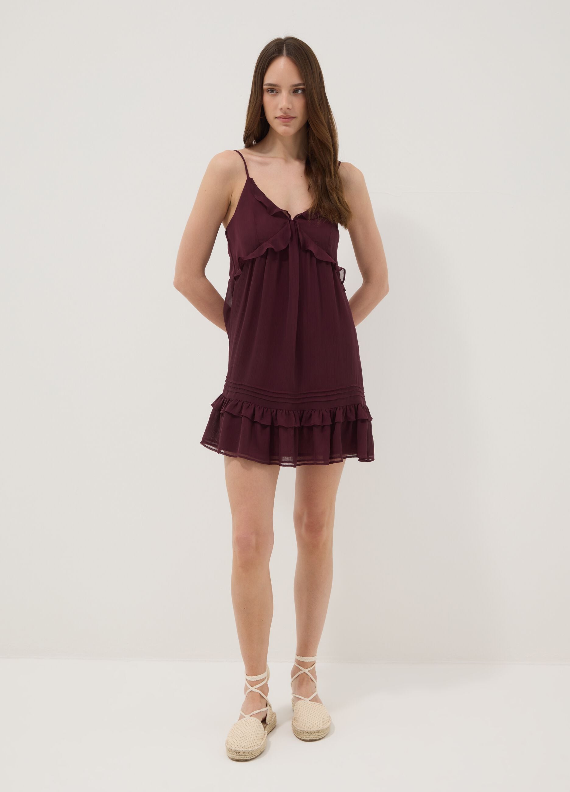 Purple mini dress with ruffles and plunging neckline