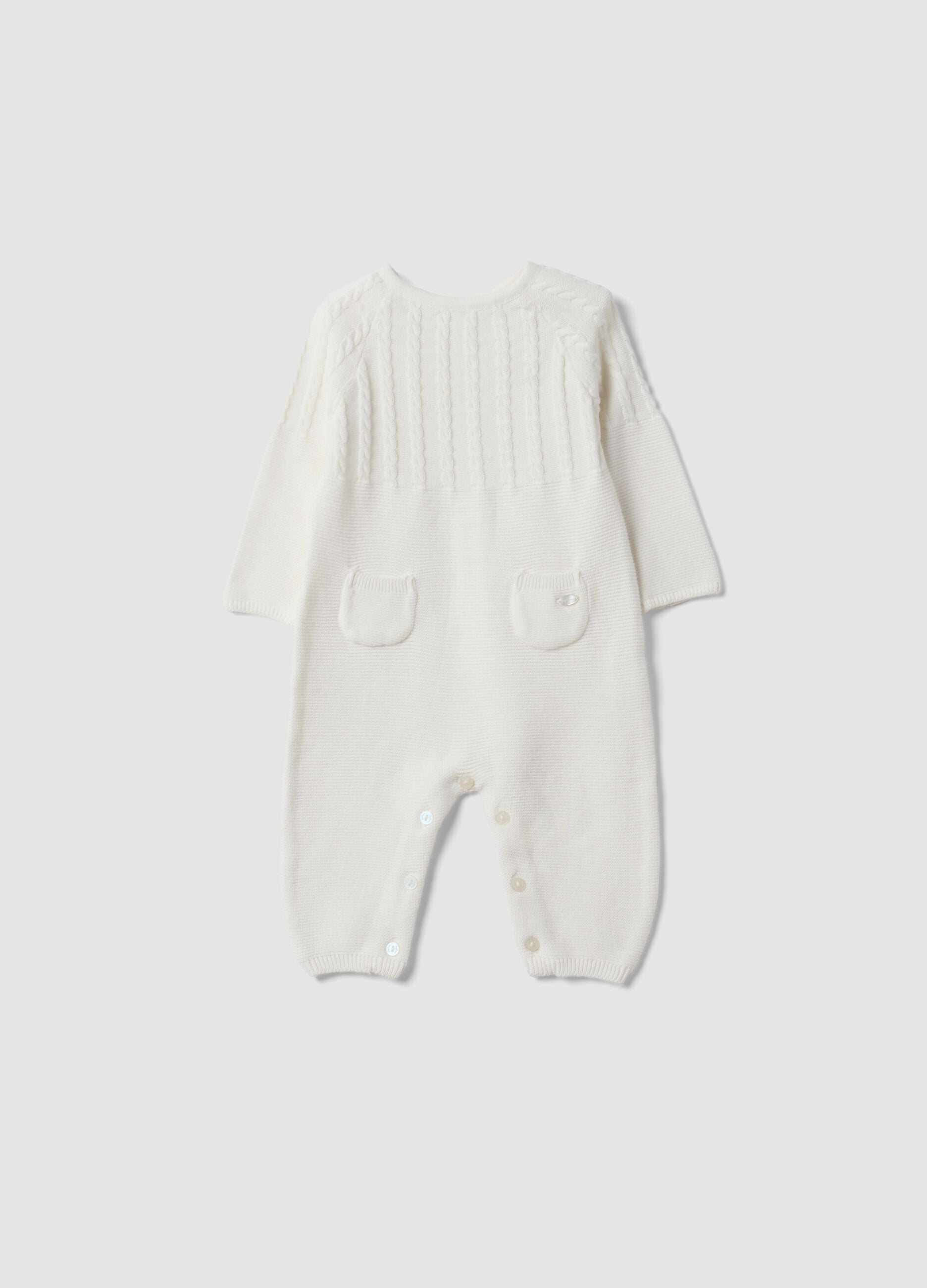 White organic cotton baby sleepsuit with cable knit detail