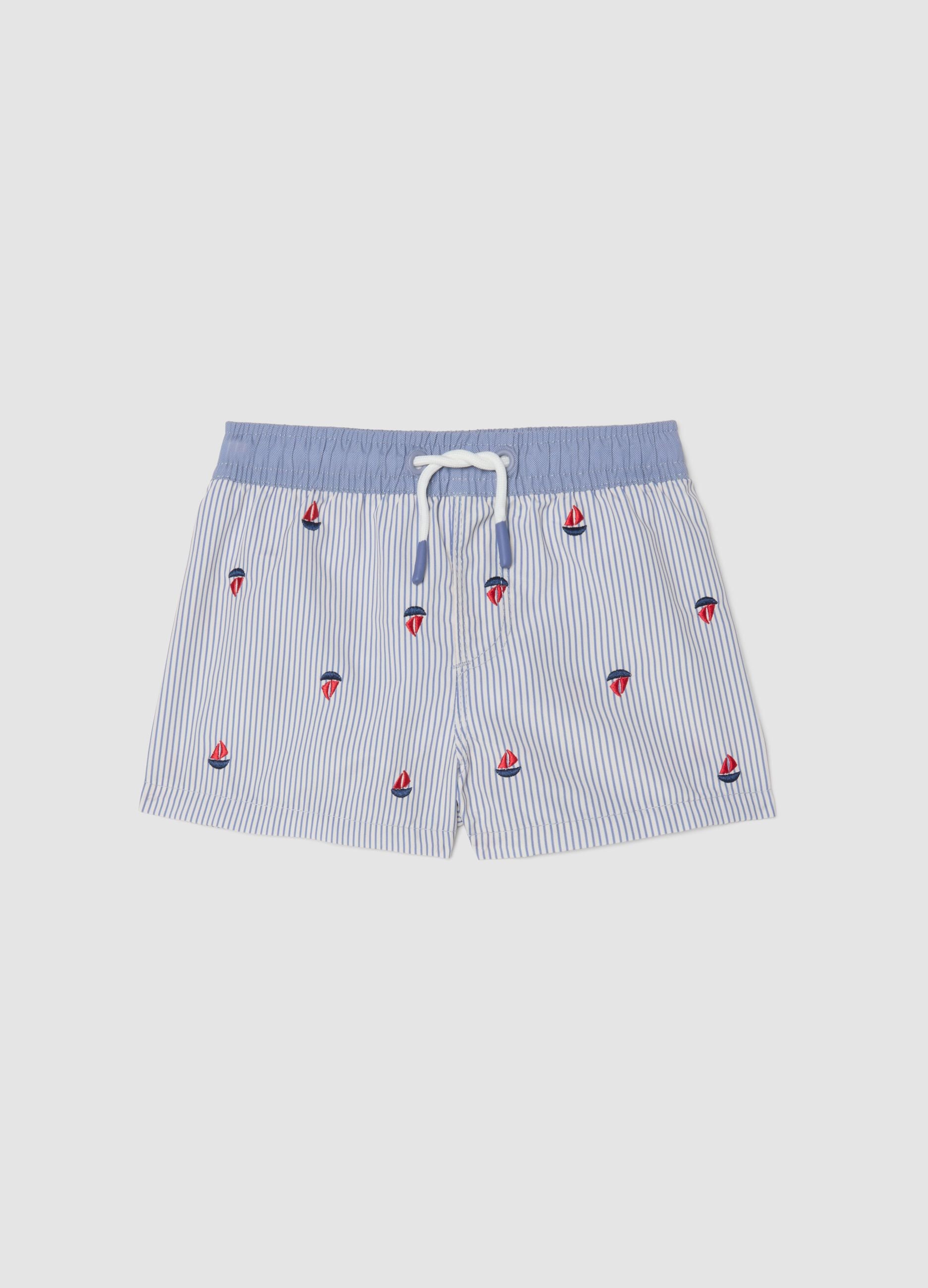 Blue striped baby swim shorts with embroidered boats
