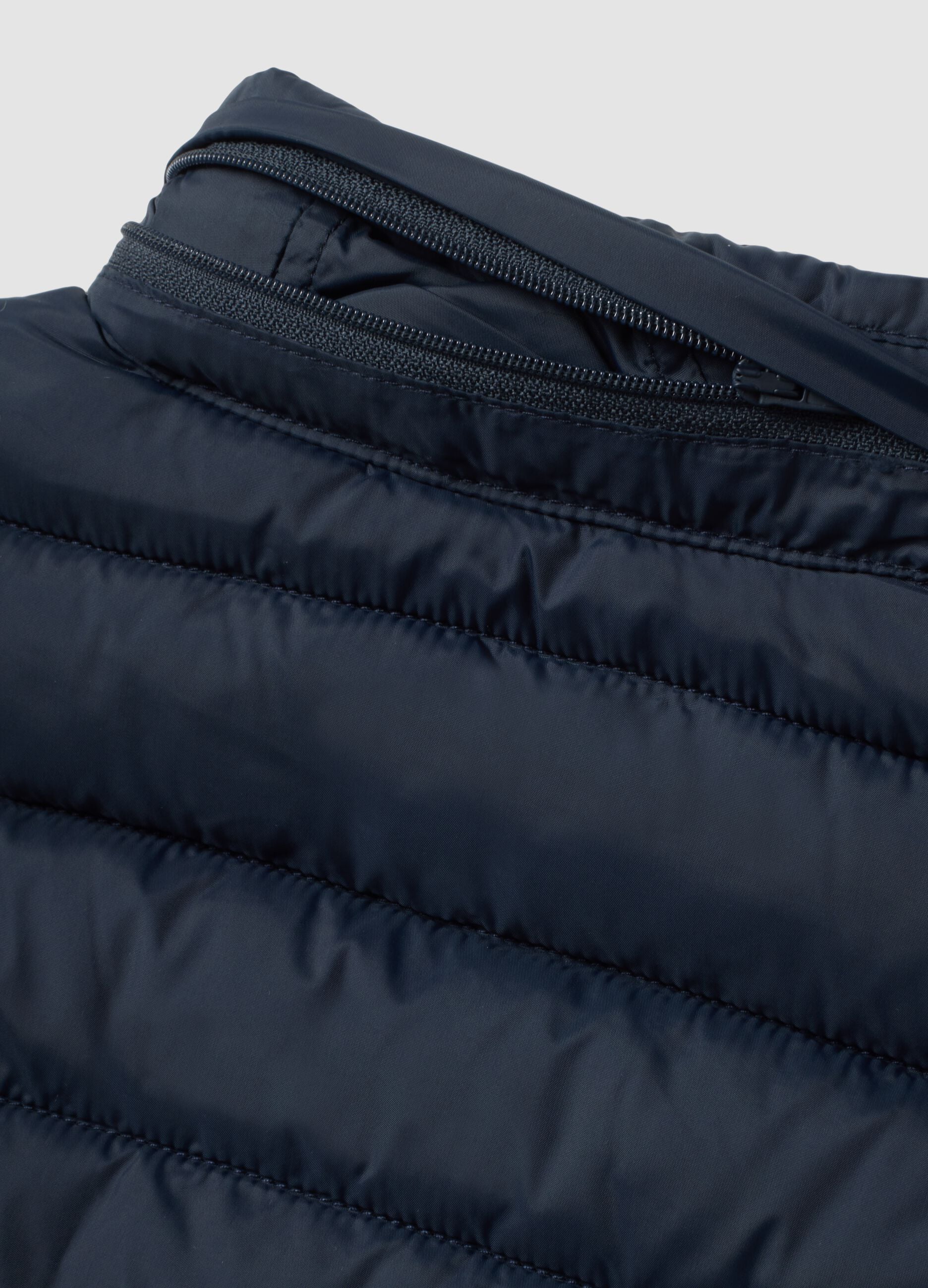 Blue padded gilet with zip and high neck for boys