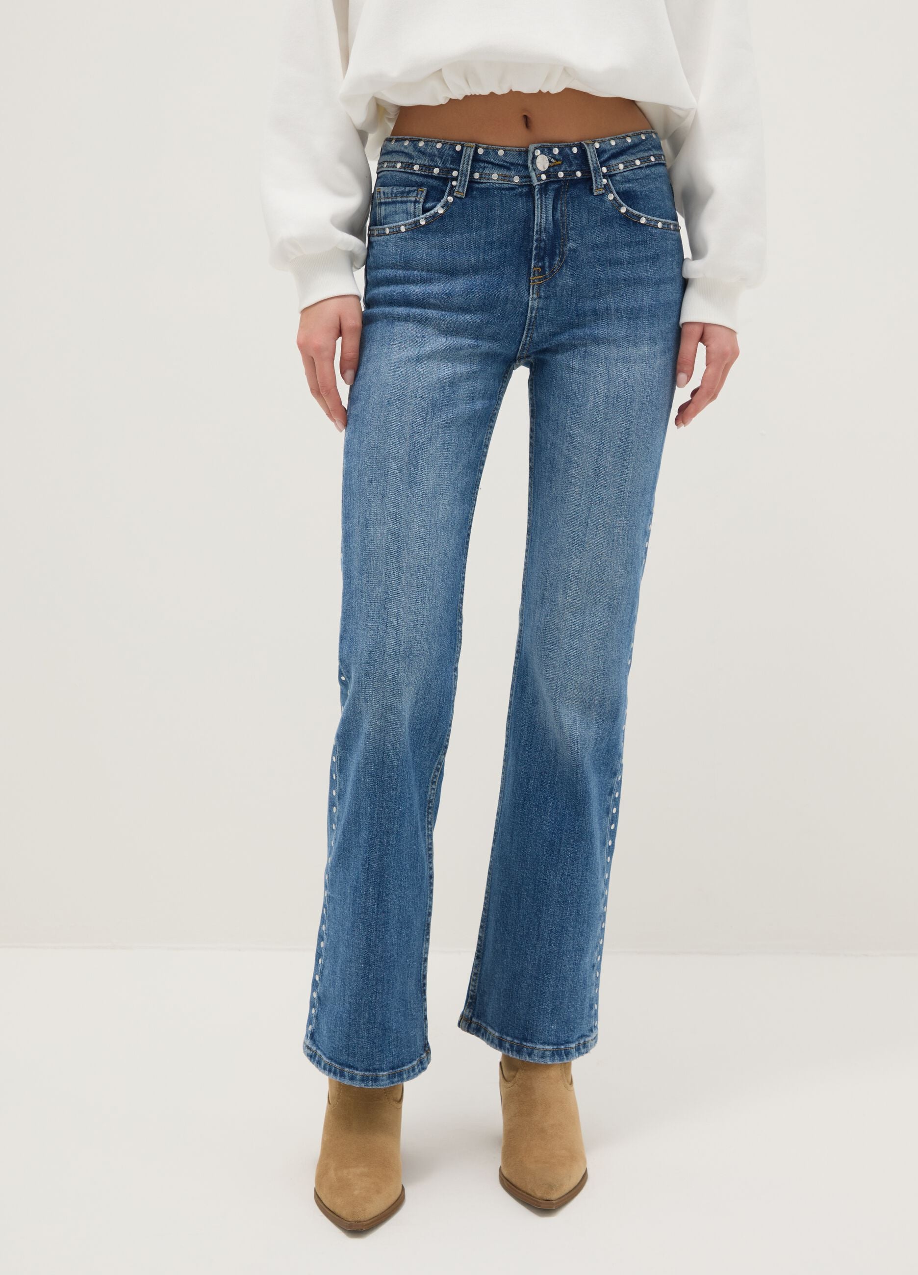 Blue denim bootcut jeans with studs