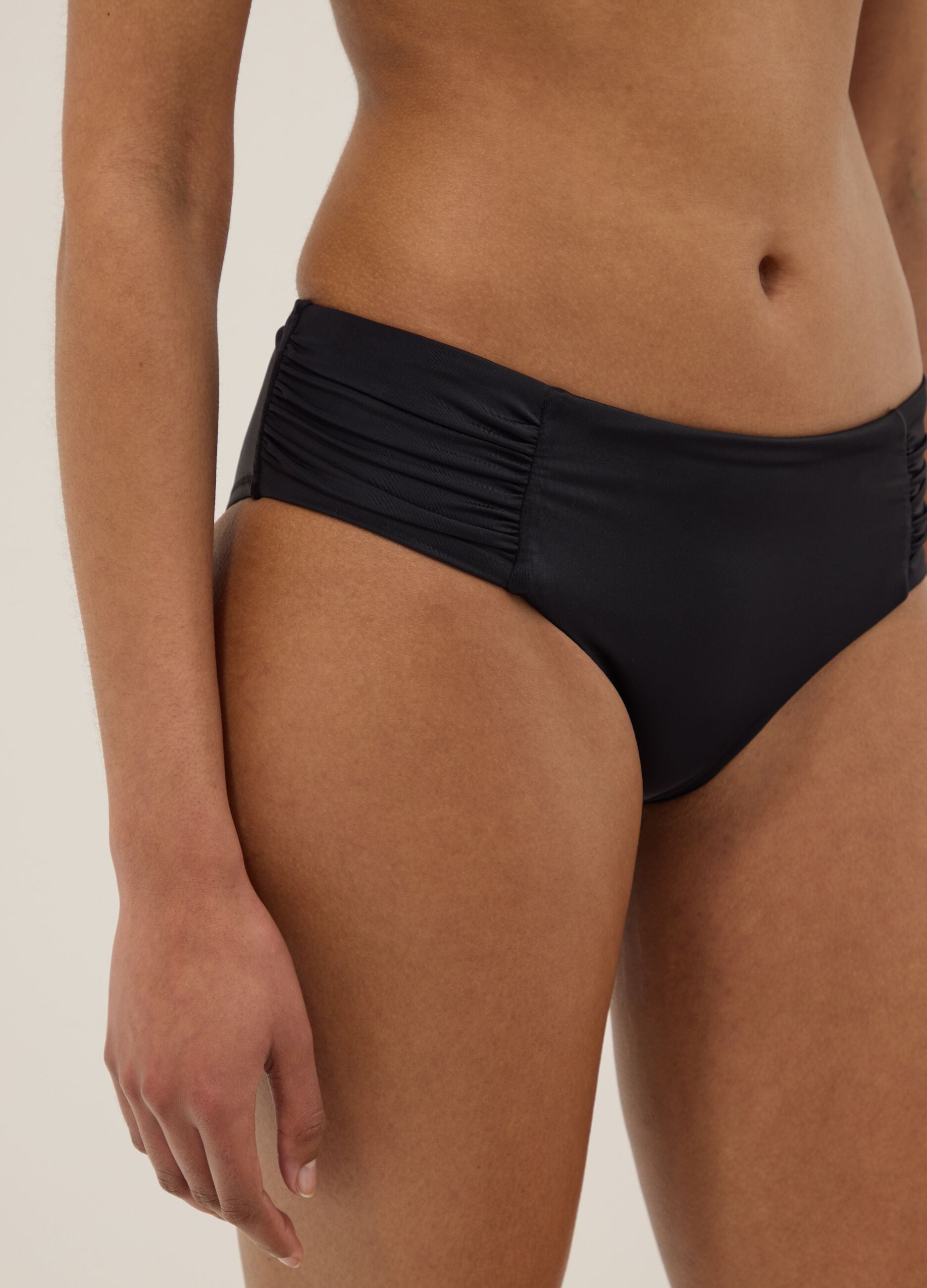 Black stretch swim briefs with side gathers