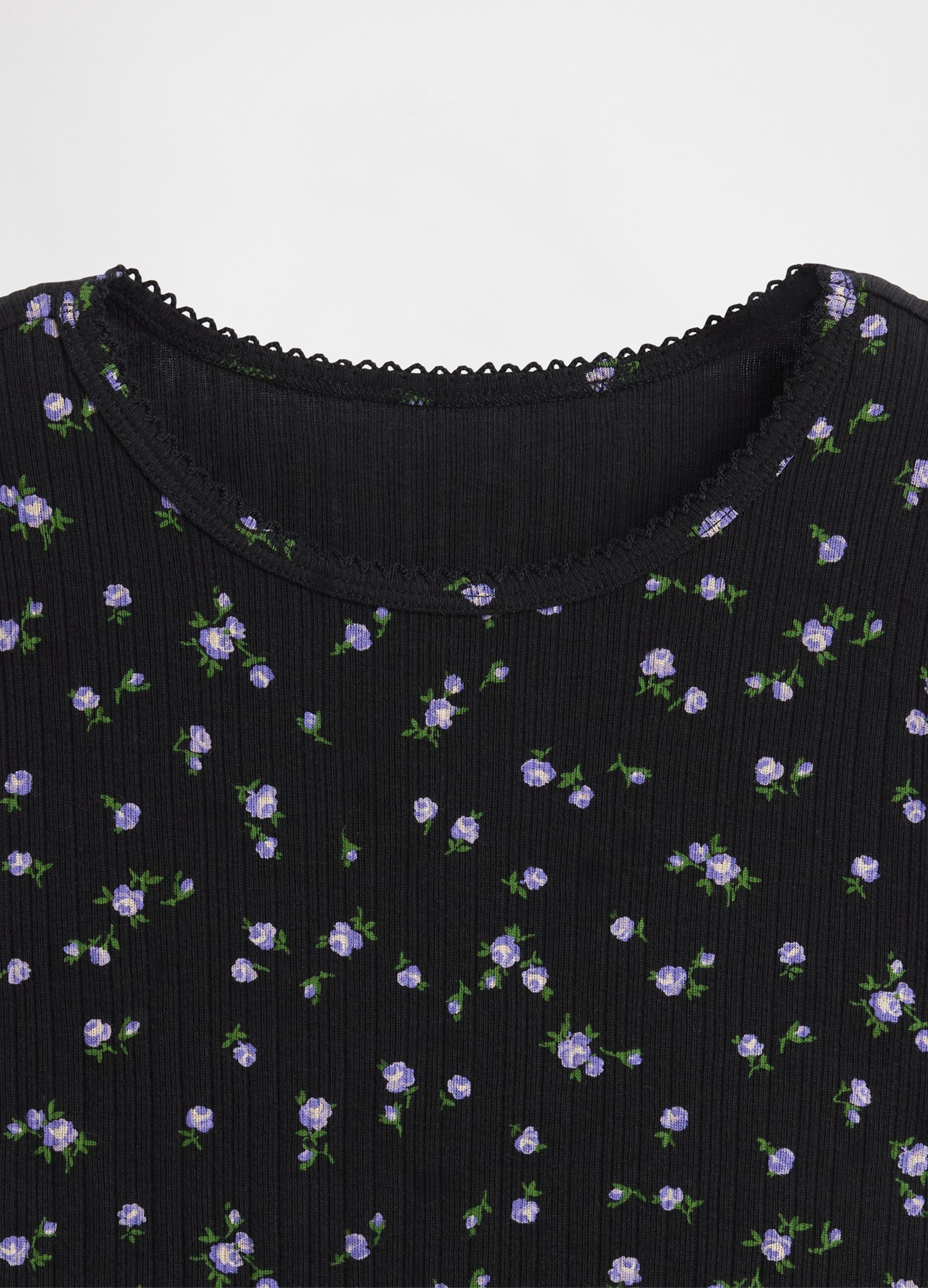 Long-sleeved black cotton shirt with floral print