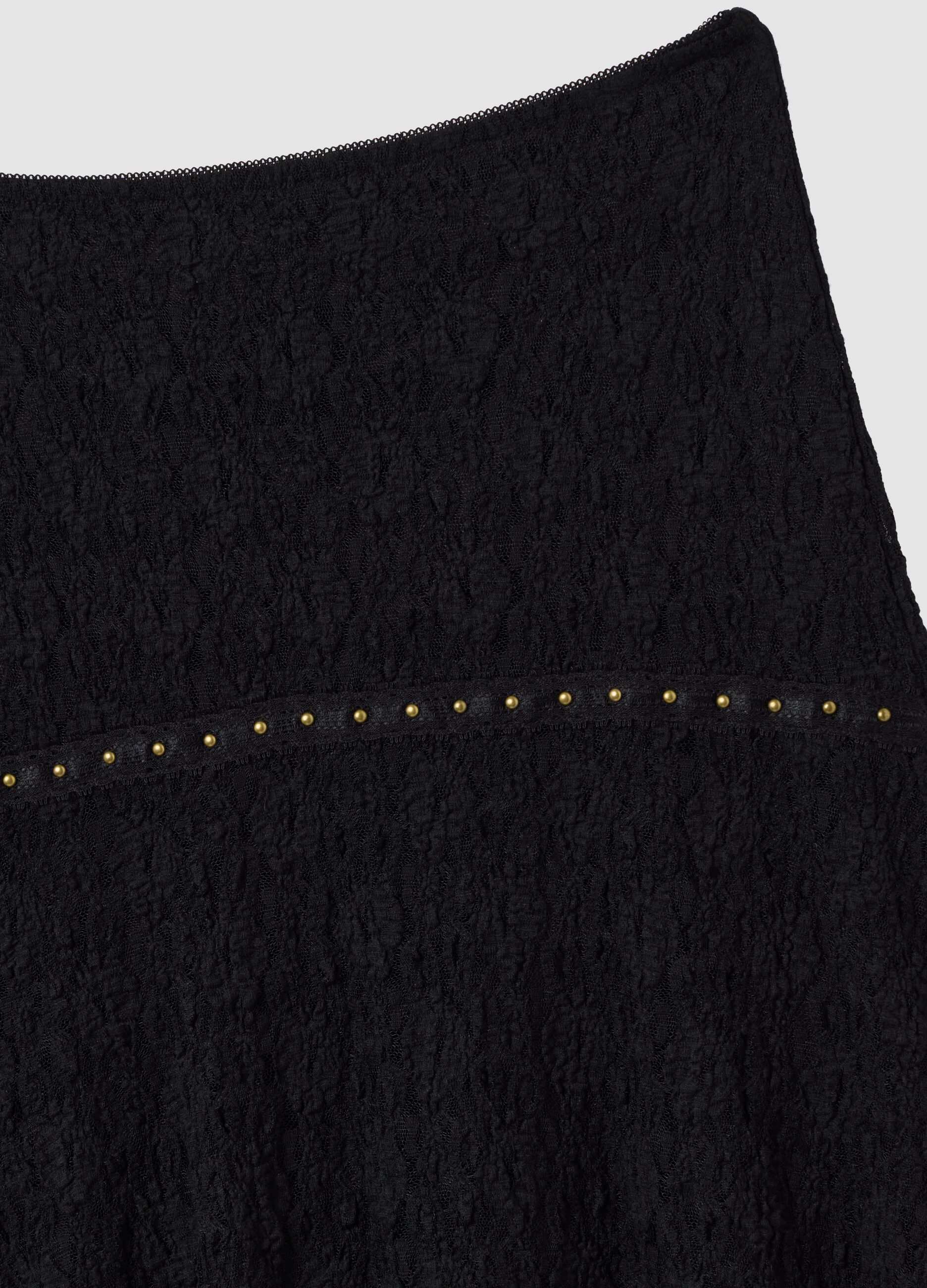 Black stretch-fabric skirt with asymmetric lace hem