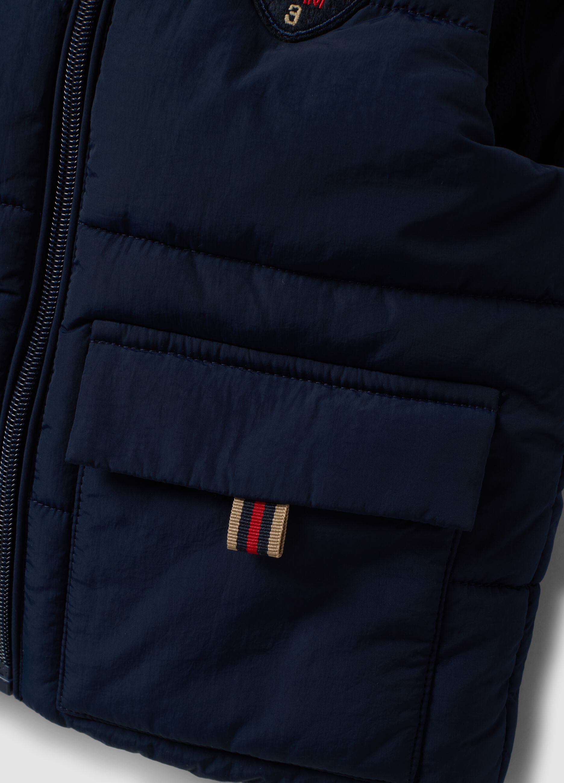 Gilet blu imbottito con cappuccio e zip per bimbo