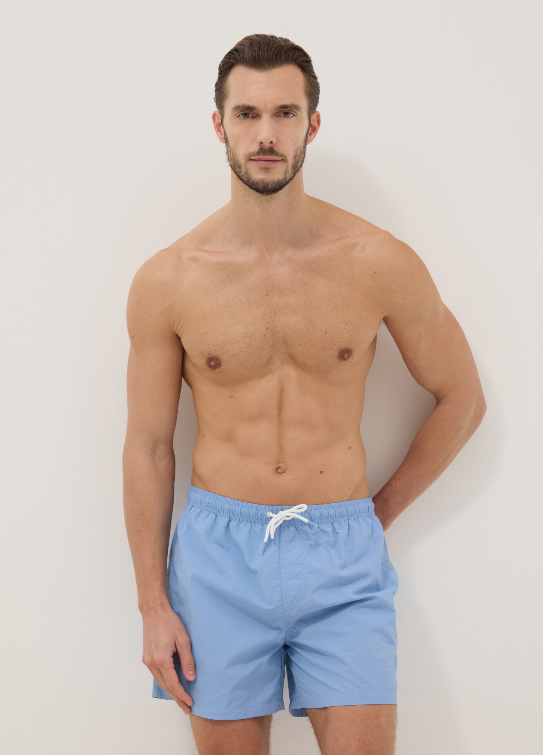 Blue swim shorts with elasticated waist