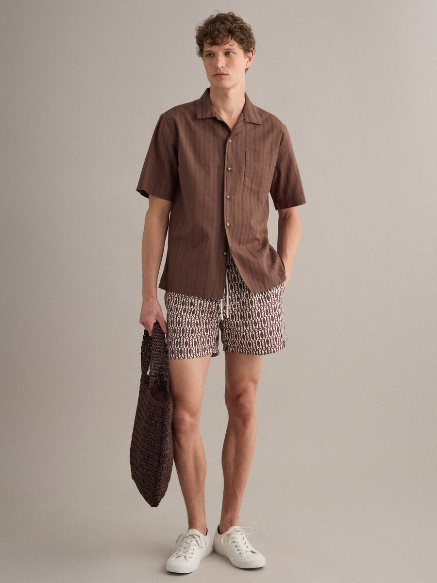 Brown geometric-print swim shorts_0
