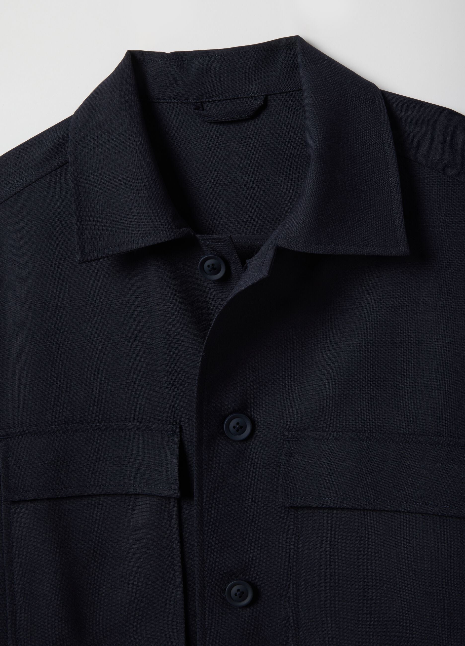 Light blue regular fit jacket with buttons and front pockets