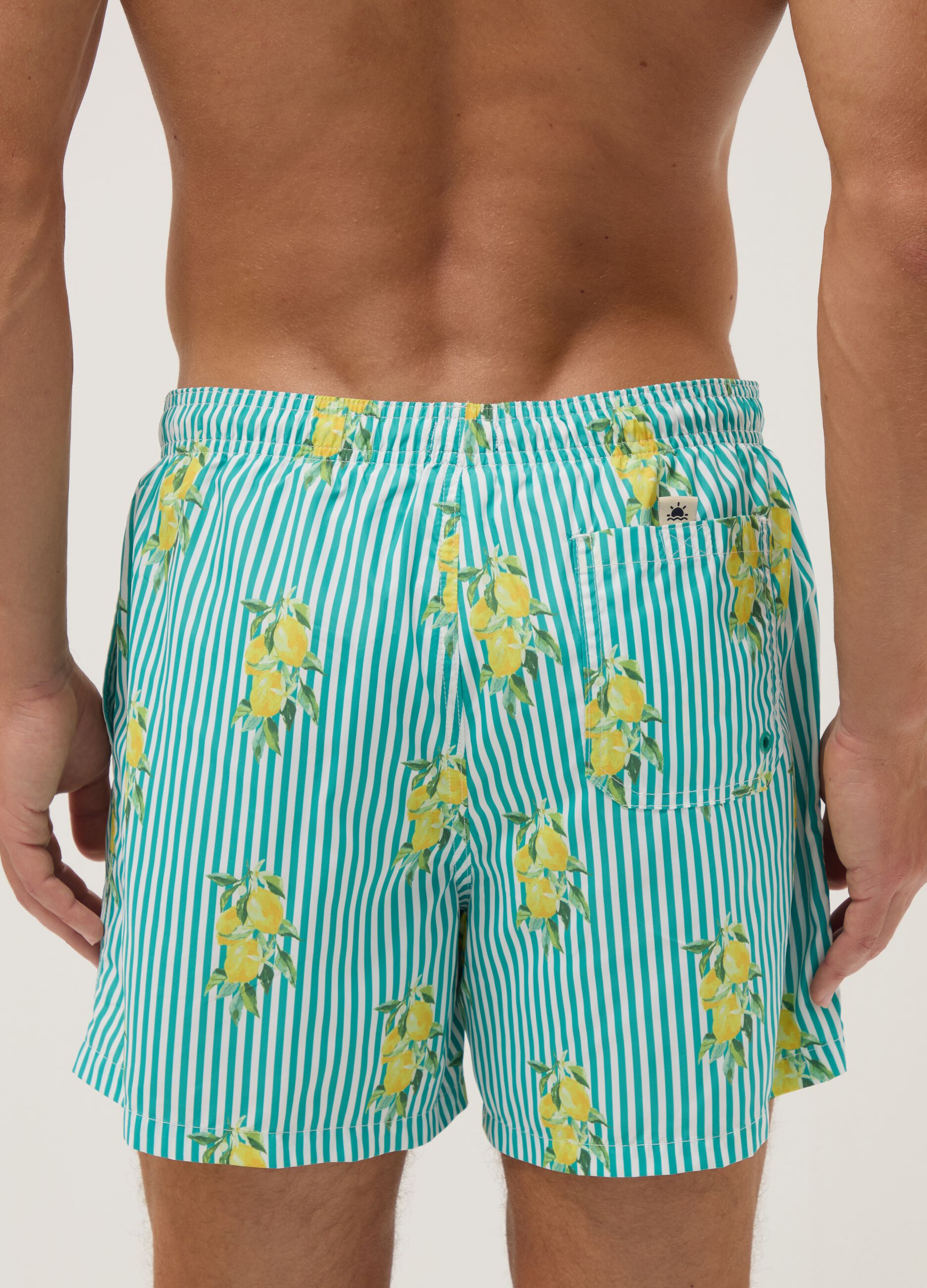 Blue striped swim shorts with lemon print