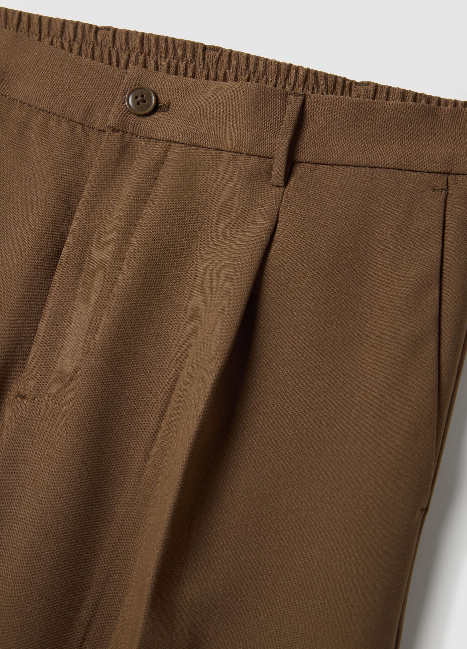 Brown slim fit elegant trousers with elastic waistband