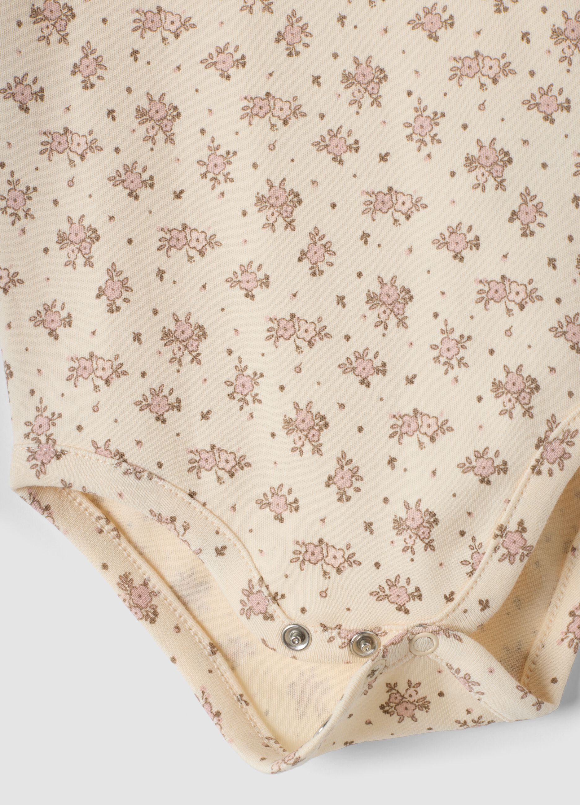 2-pack beige organic cotton bodysuits with print