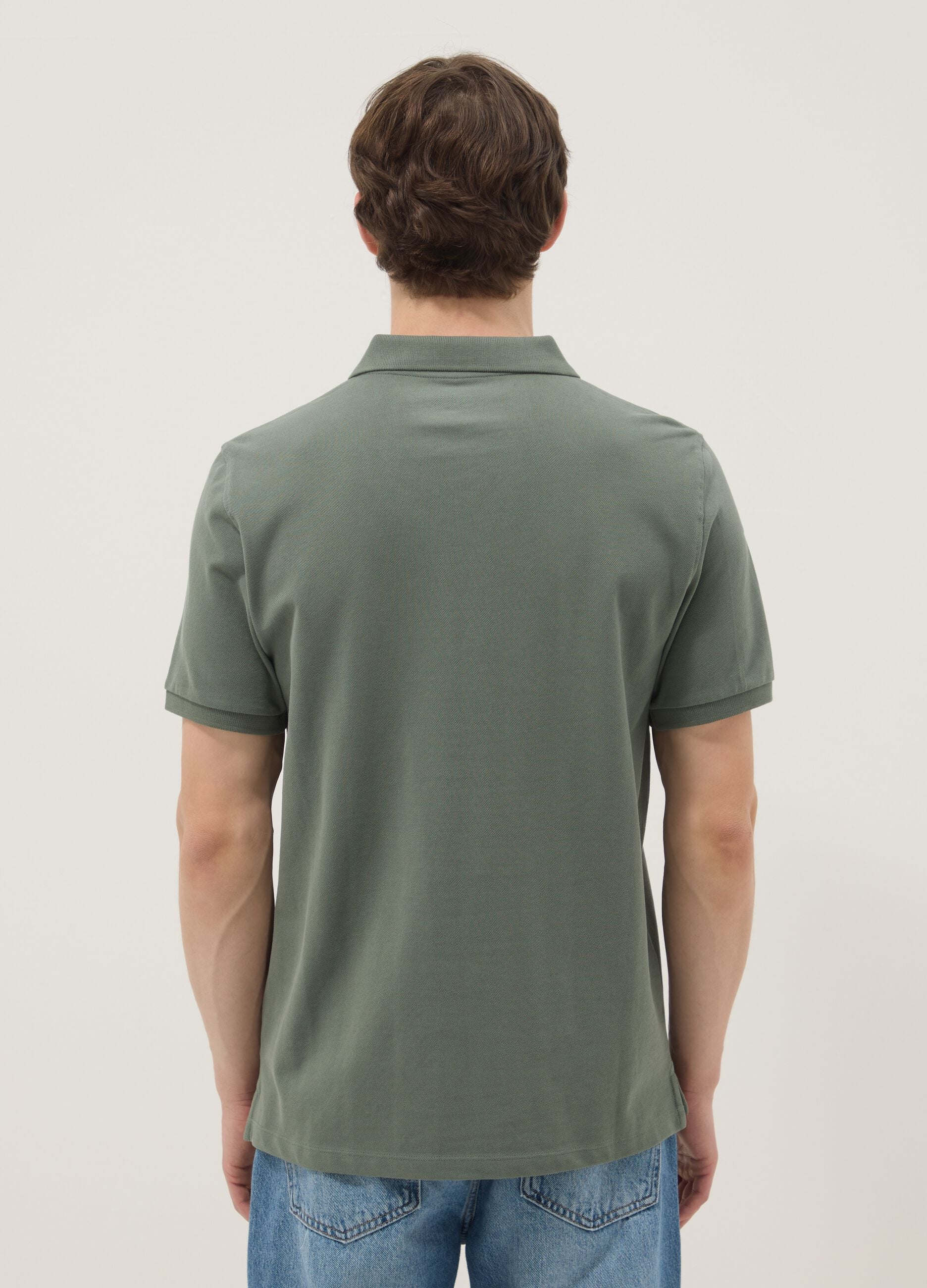 Green short-sleeved polo shirt in pure organic cotton