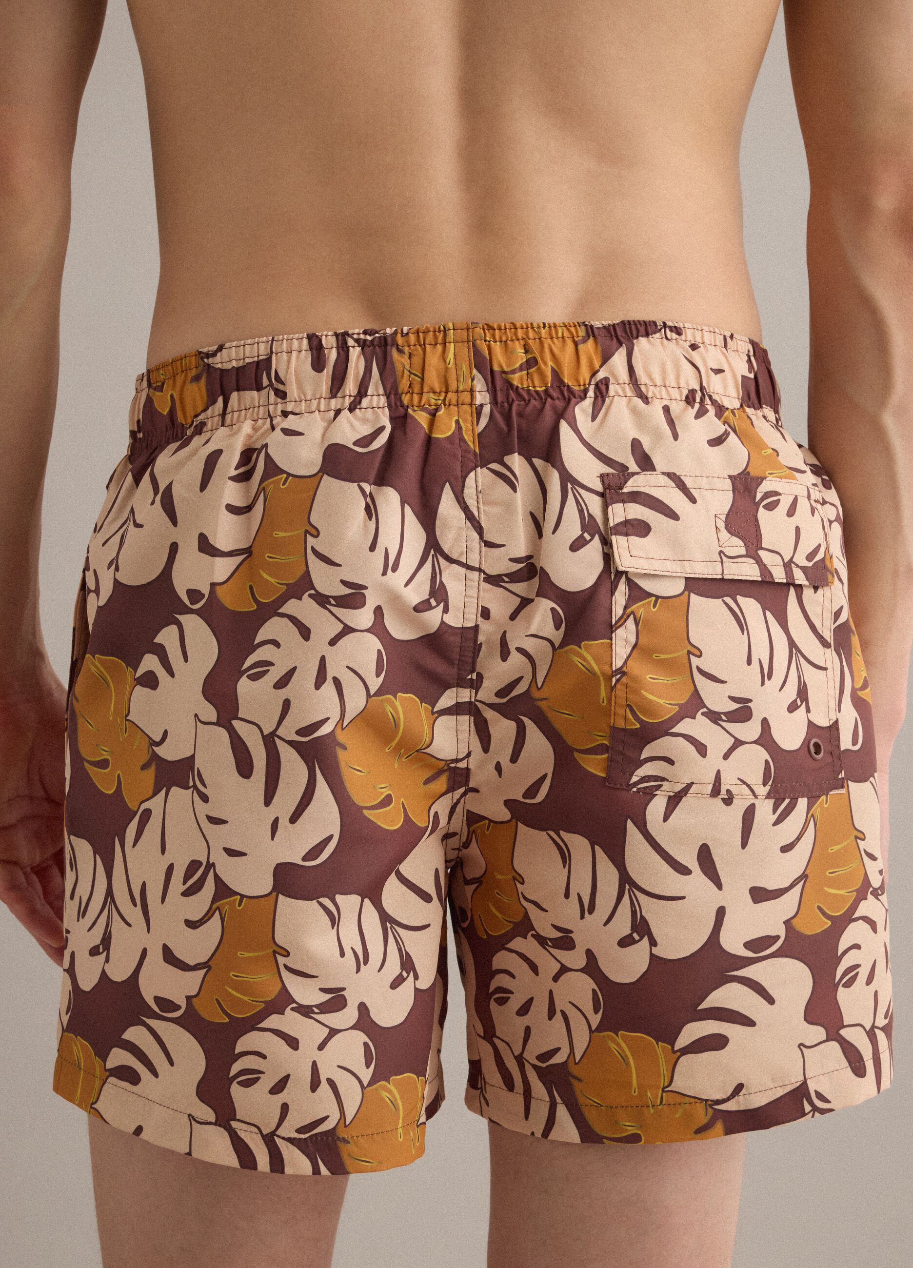 Brown tropical-print swim shorts
