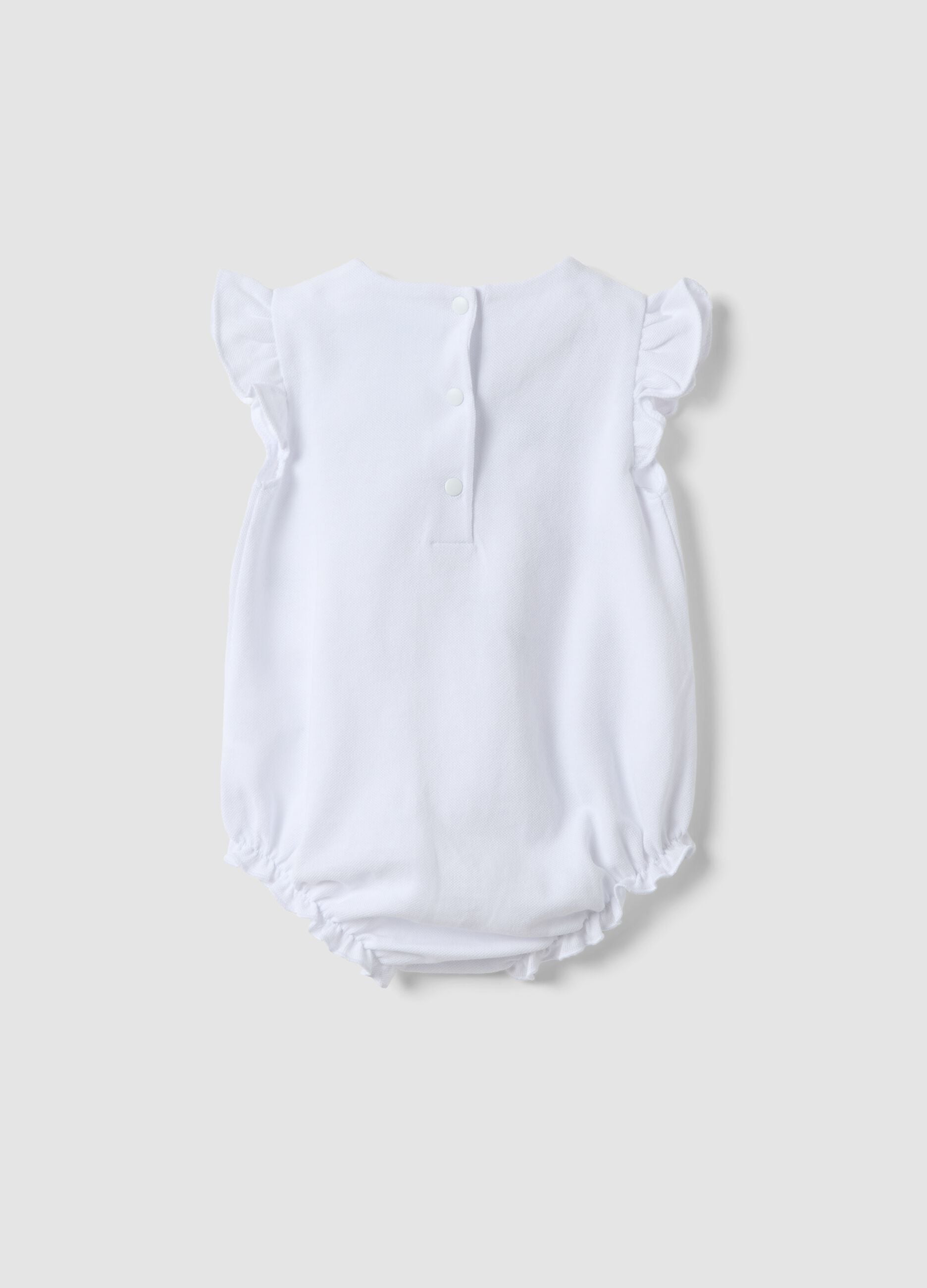 White organic cotton baby romper with ruffles