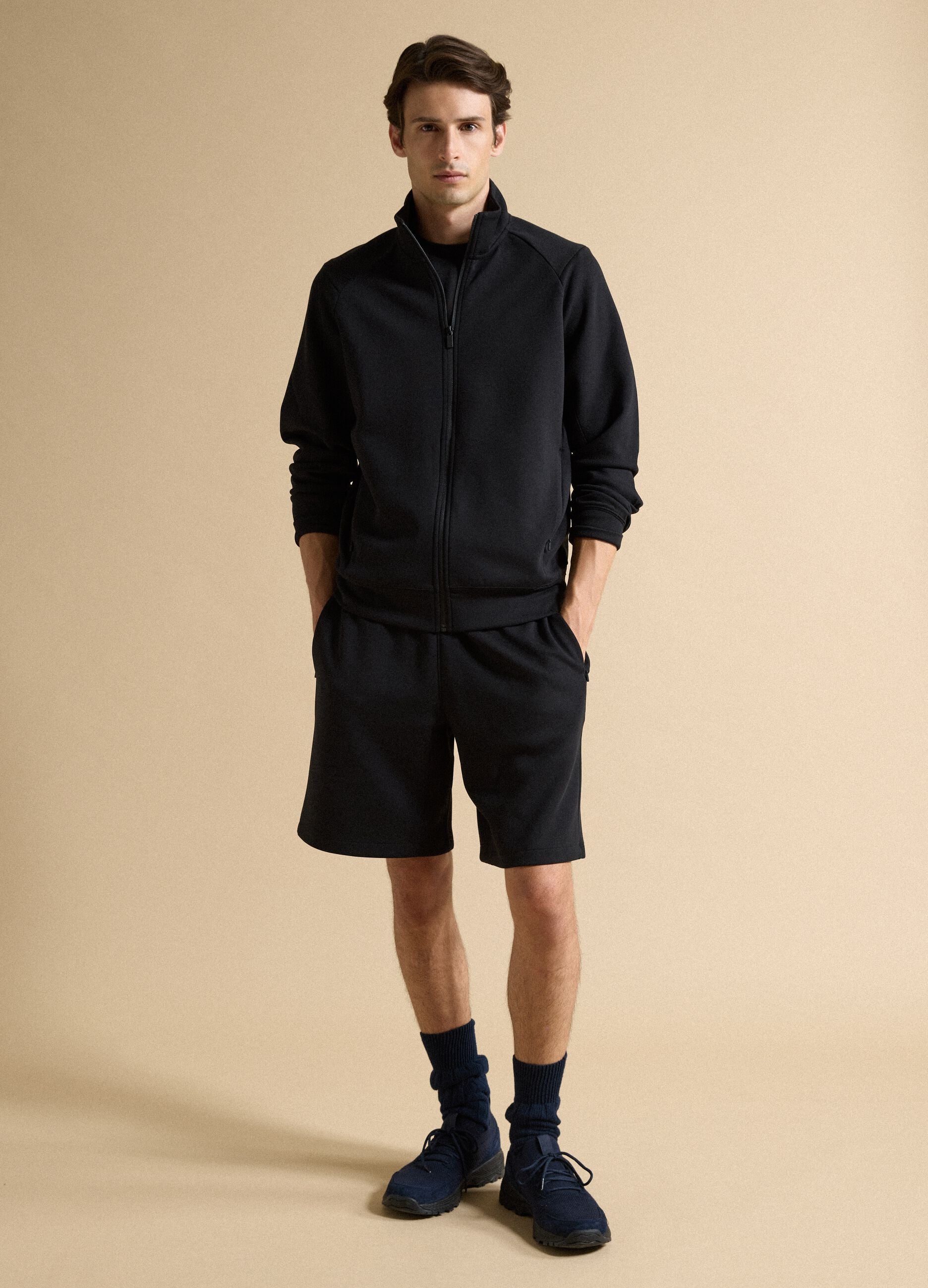 Black full-zip jacket with stretch Easy Dry collar, regular fit