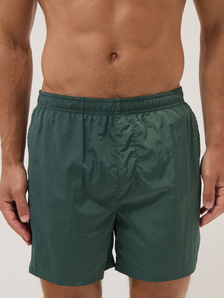Green swim shorts with elasticated waistband_1