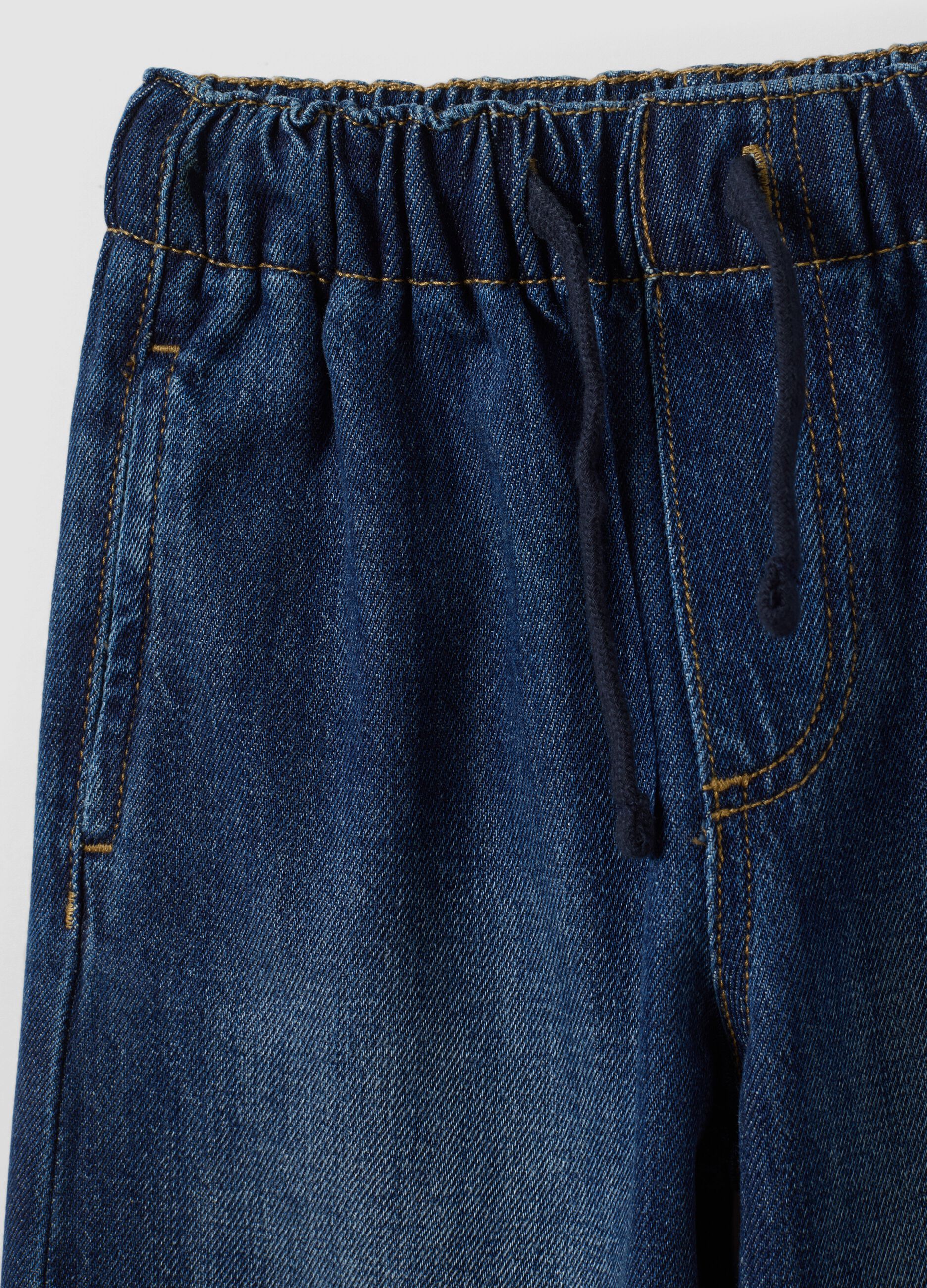 Blue denim joggers in cotton and viscose blend with cargo pockets, relaxed fit