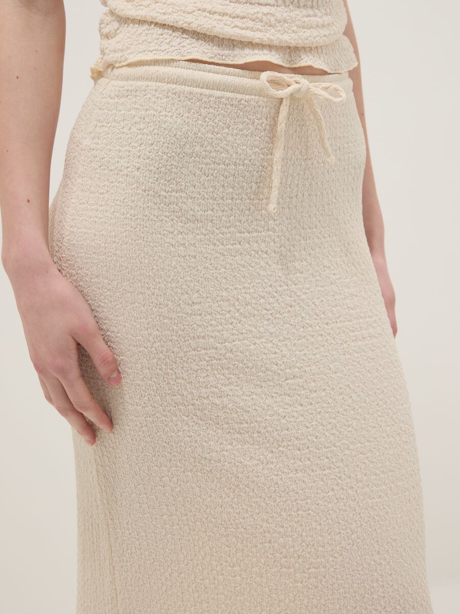 Beige long skirt in stretchy textured fabric_3
