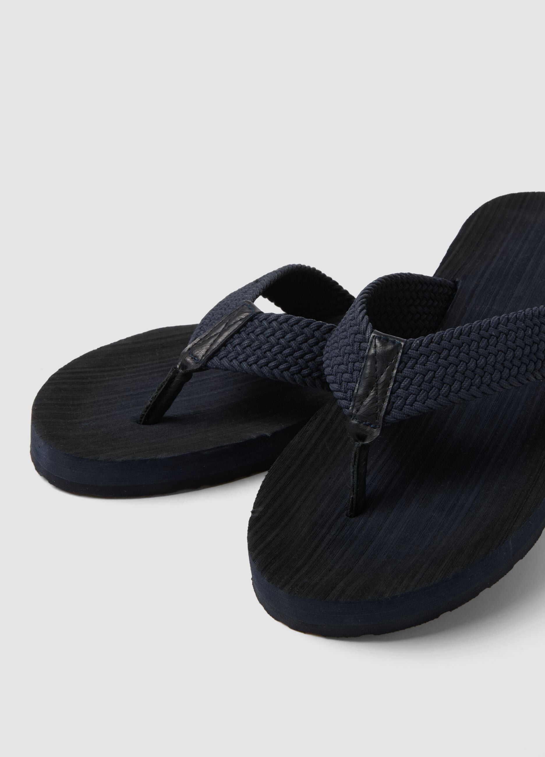 Blue flip-flops with woven strap
