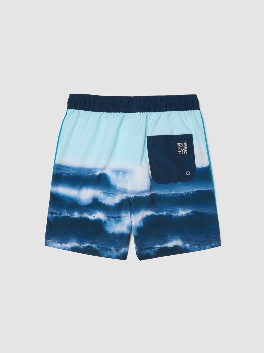 Blue boys&rsquo; swim shorts with wave print_1