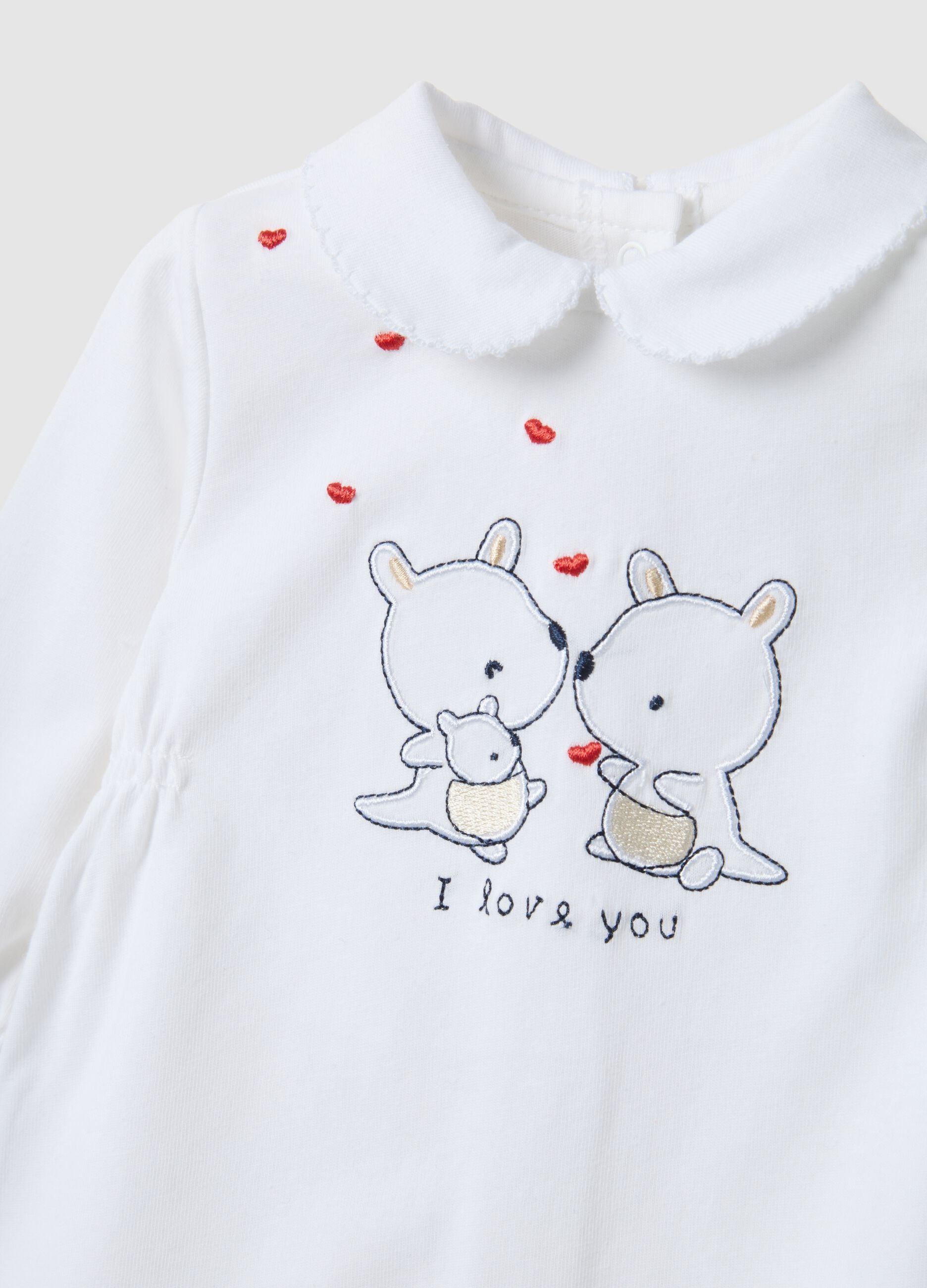 Baby girl's white pure cotton romper with embroidery and buttons