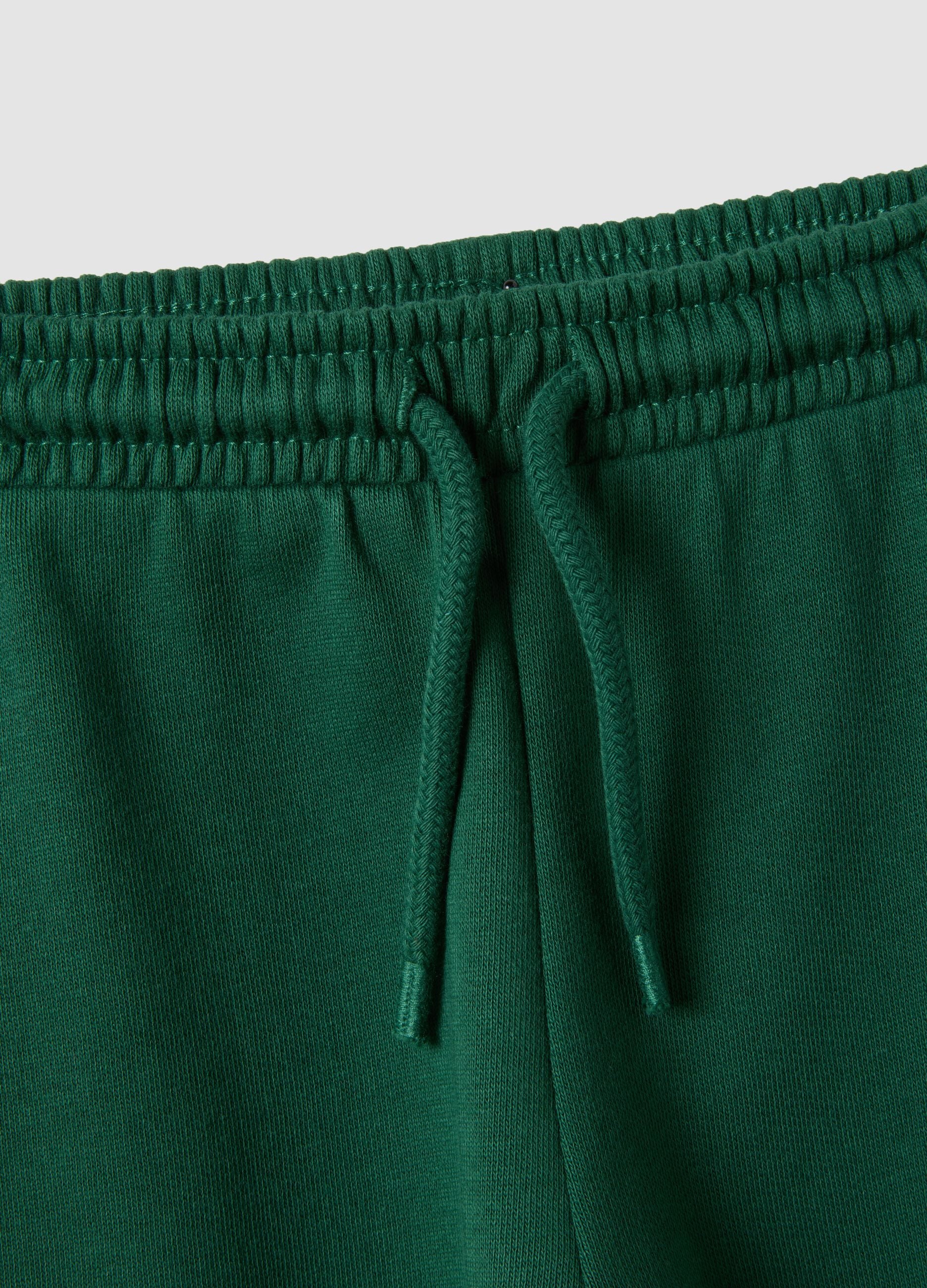Green organic cotton jogger trousers with drawstring for baby boys