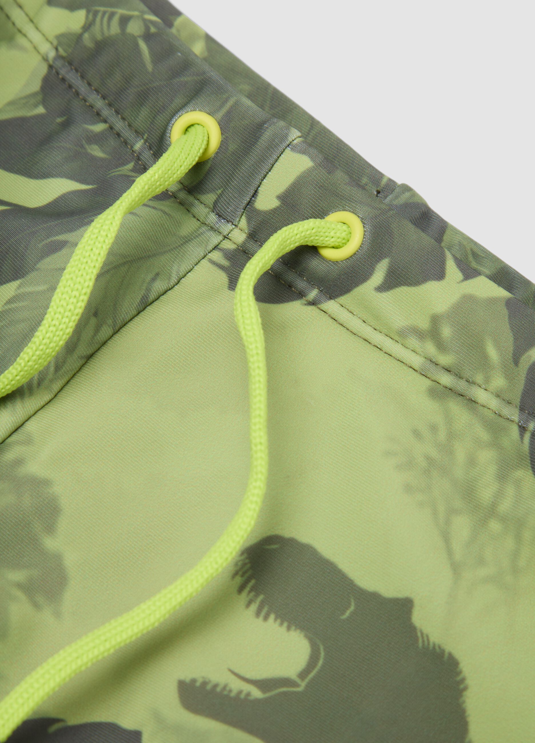 Green dinosaur-print stretch swim trunks