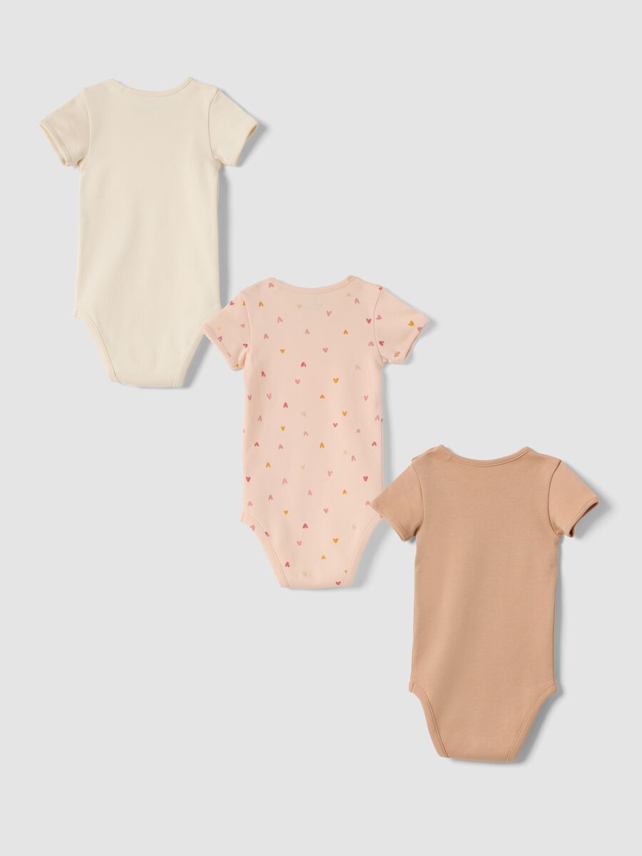 Three-pack of pink organic cotton crew-neck bodysuits_1