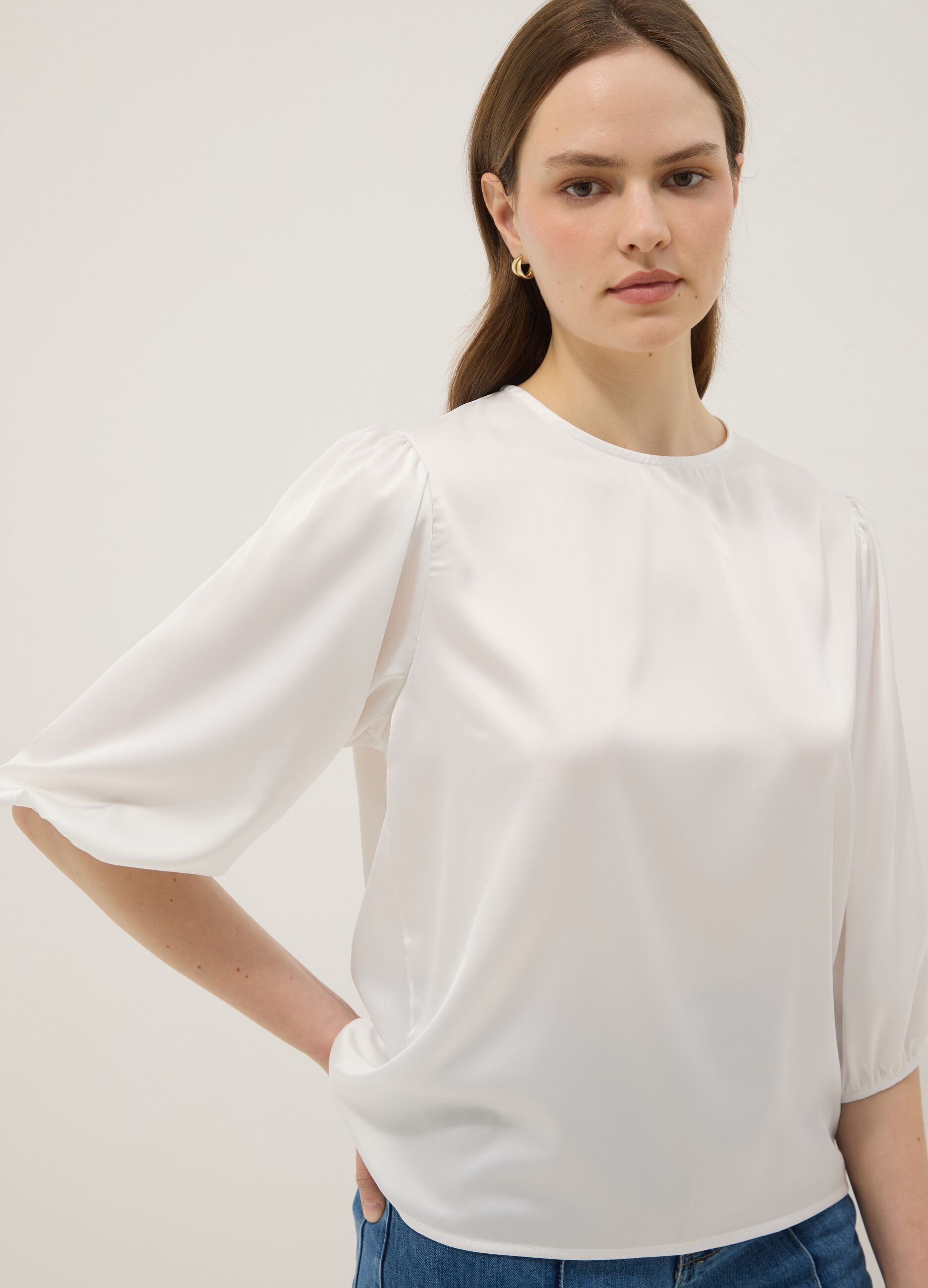 White long-sleeve top with wide sleeves