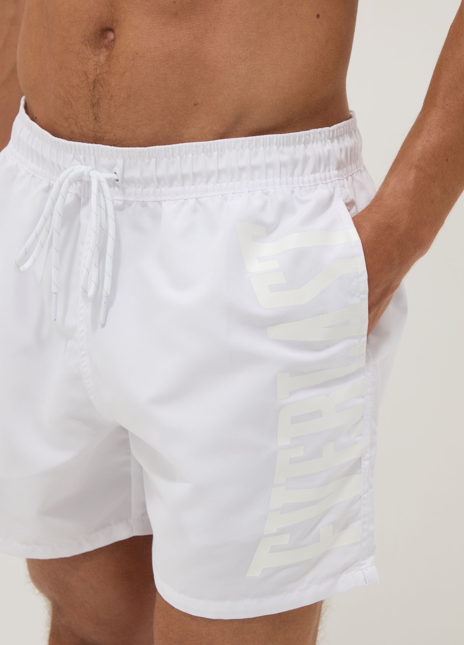 White swim shorts with drawstring