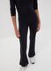 Black flared stretch organic cotton trousers for girls_1