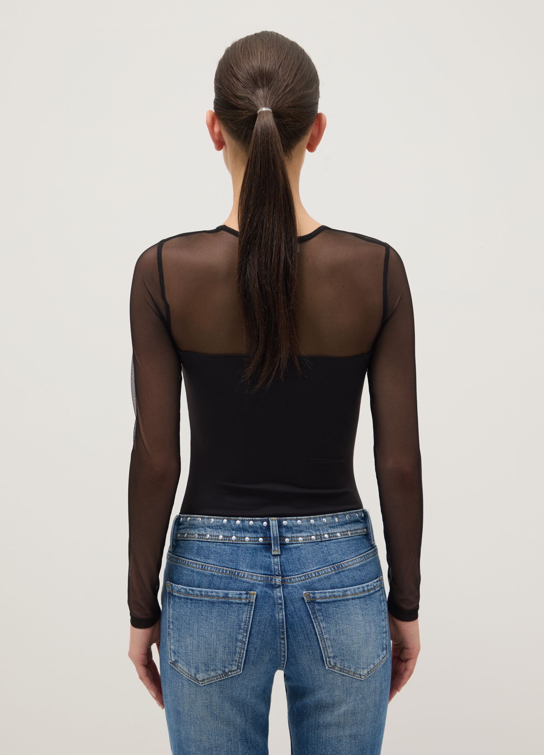 Black slim fit bodysuit with sheer accents