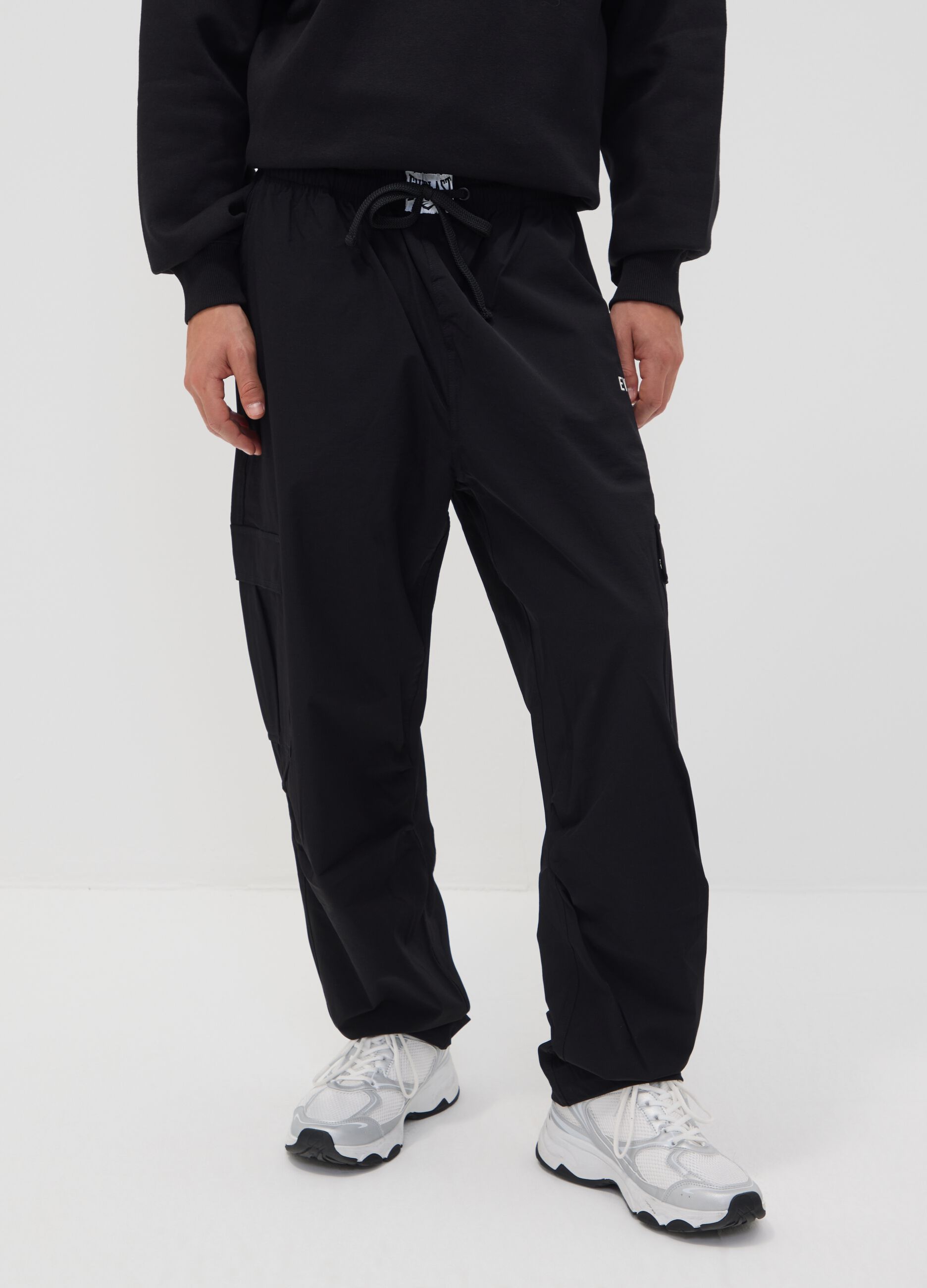 Black sporty cargo trousers with drawstring