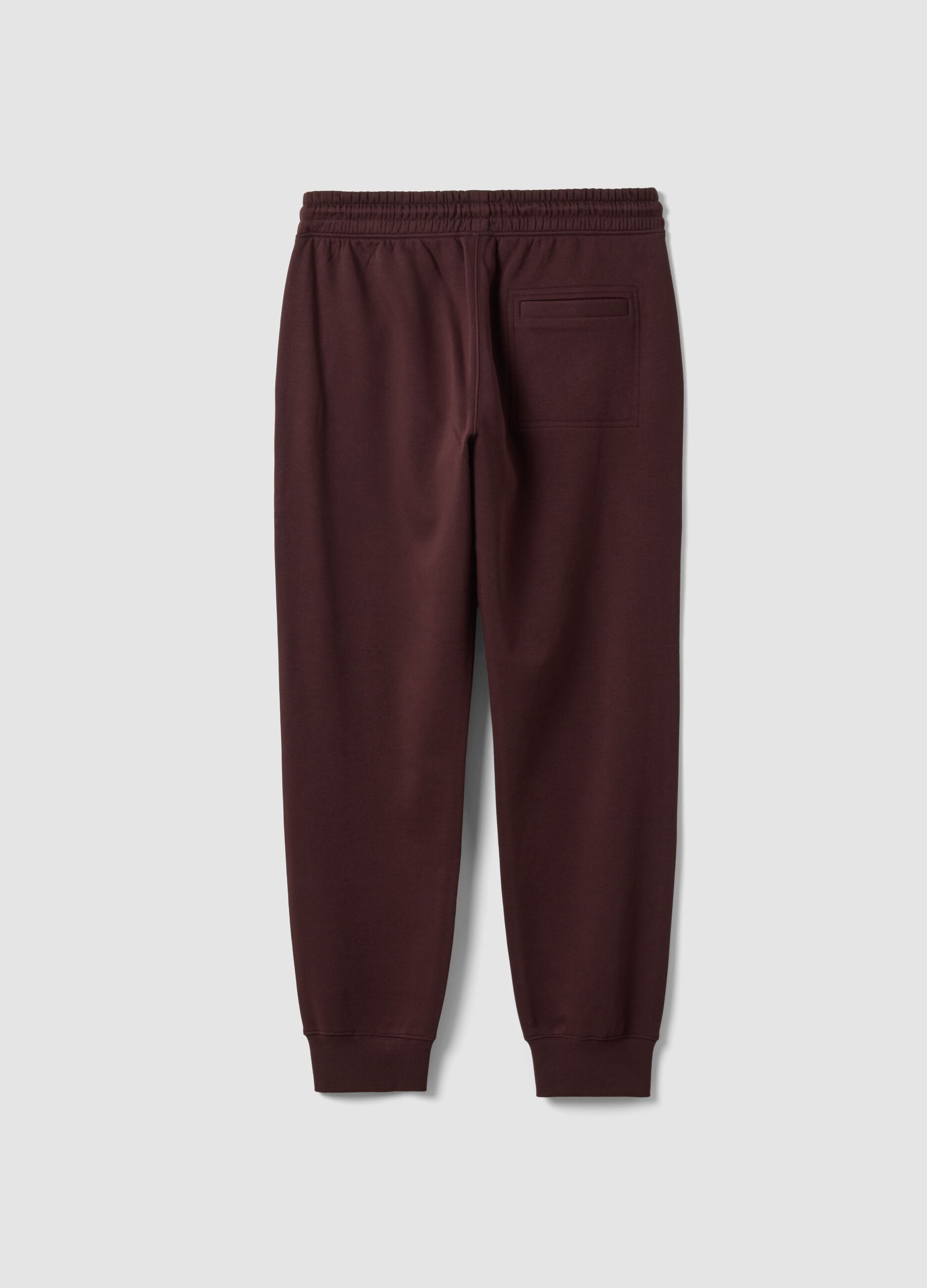 Brown cotton-blend joggers with cuffed hems and drawstring