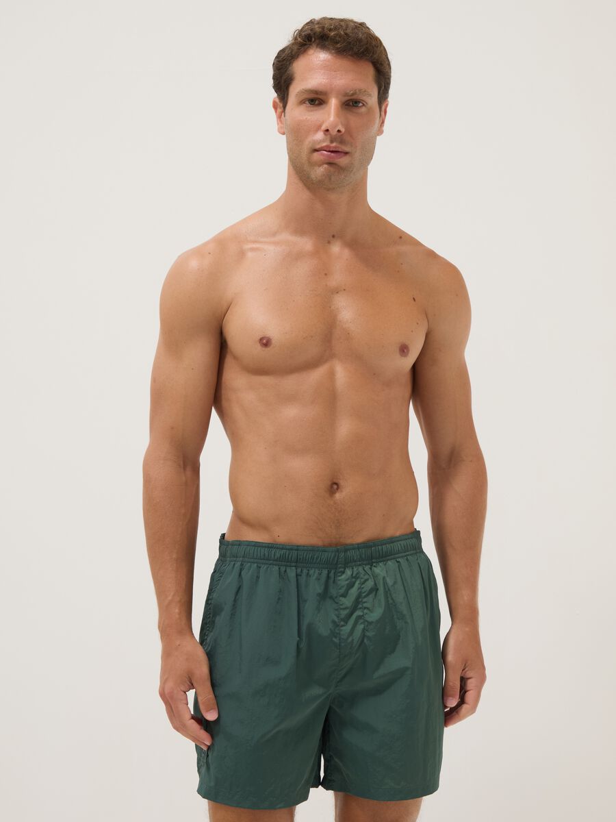 Green swim shorts with elasticated waistband_0