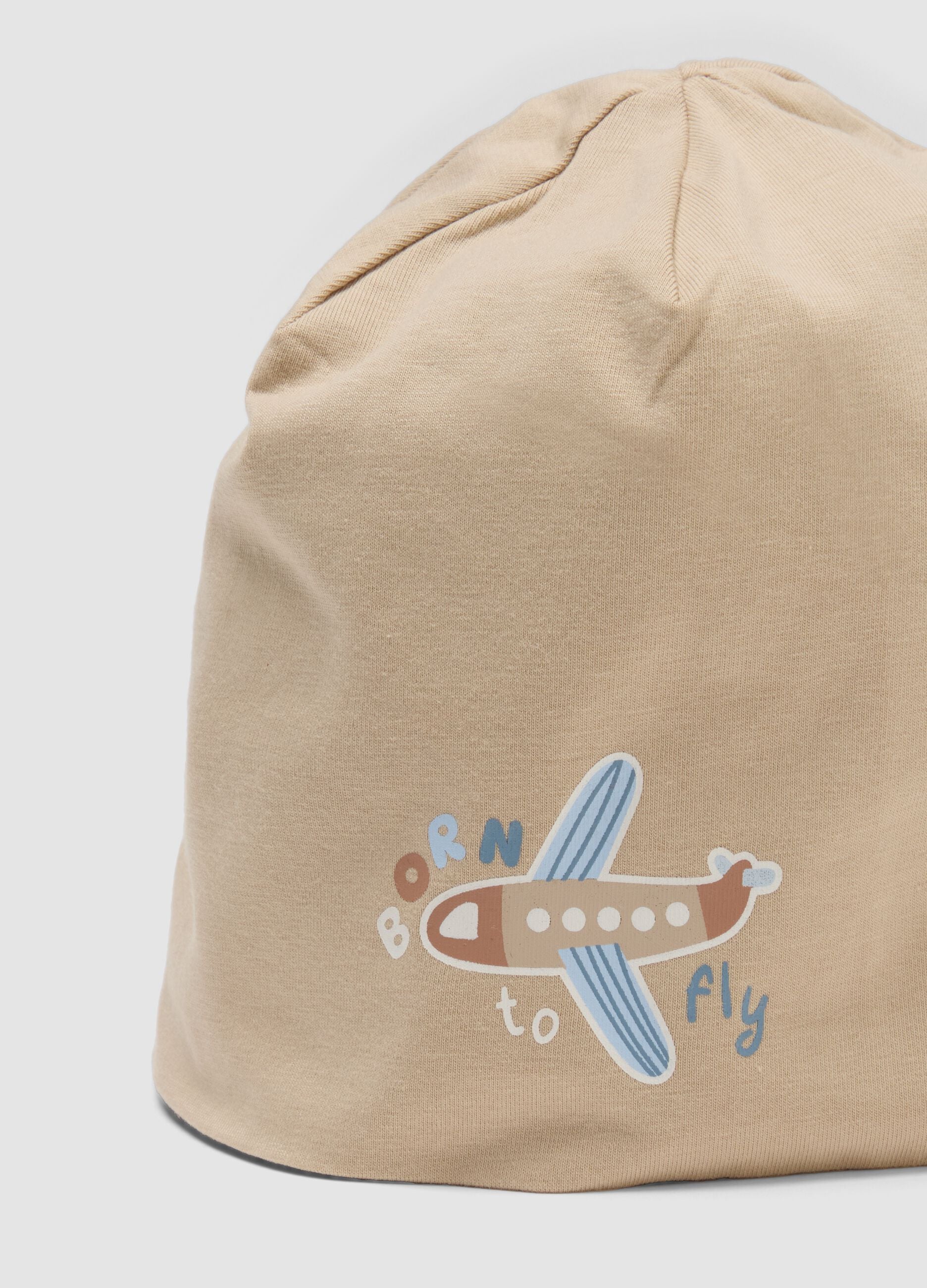 Beige stretch organic cotton baby hat with aeroplane print