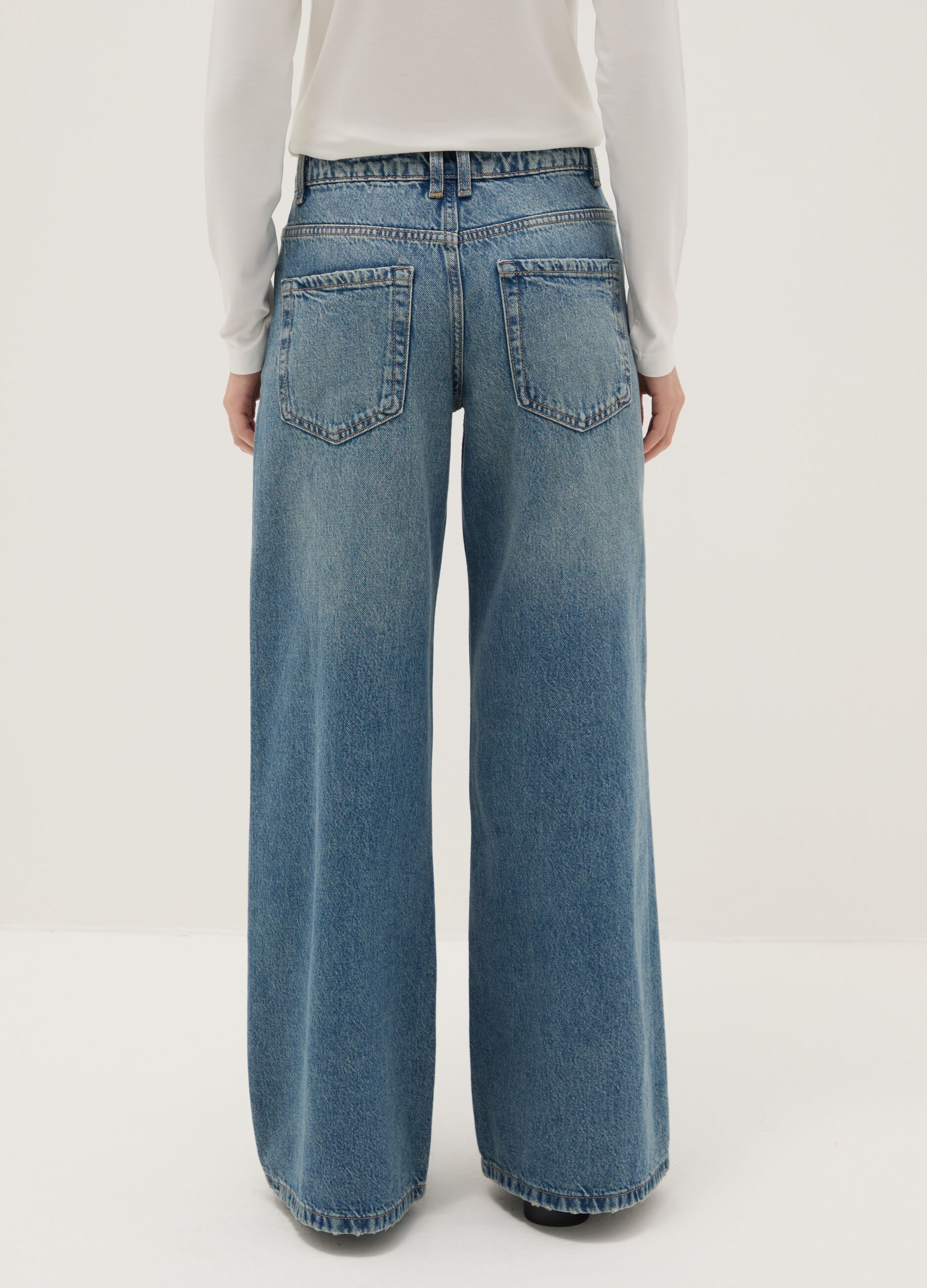 Wide leg blue cotton jeans with rips